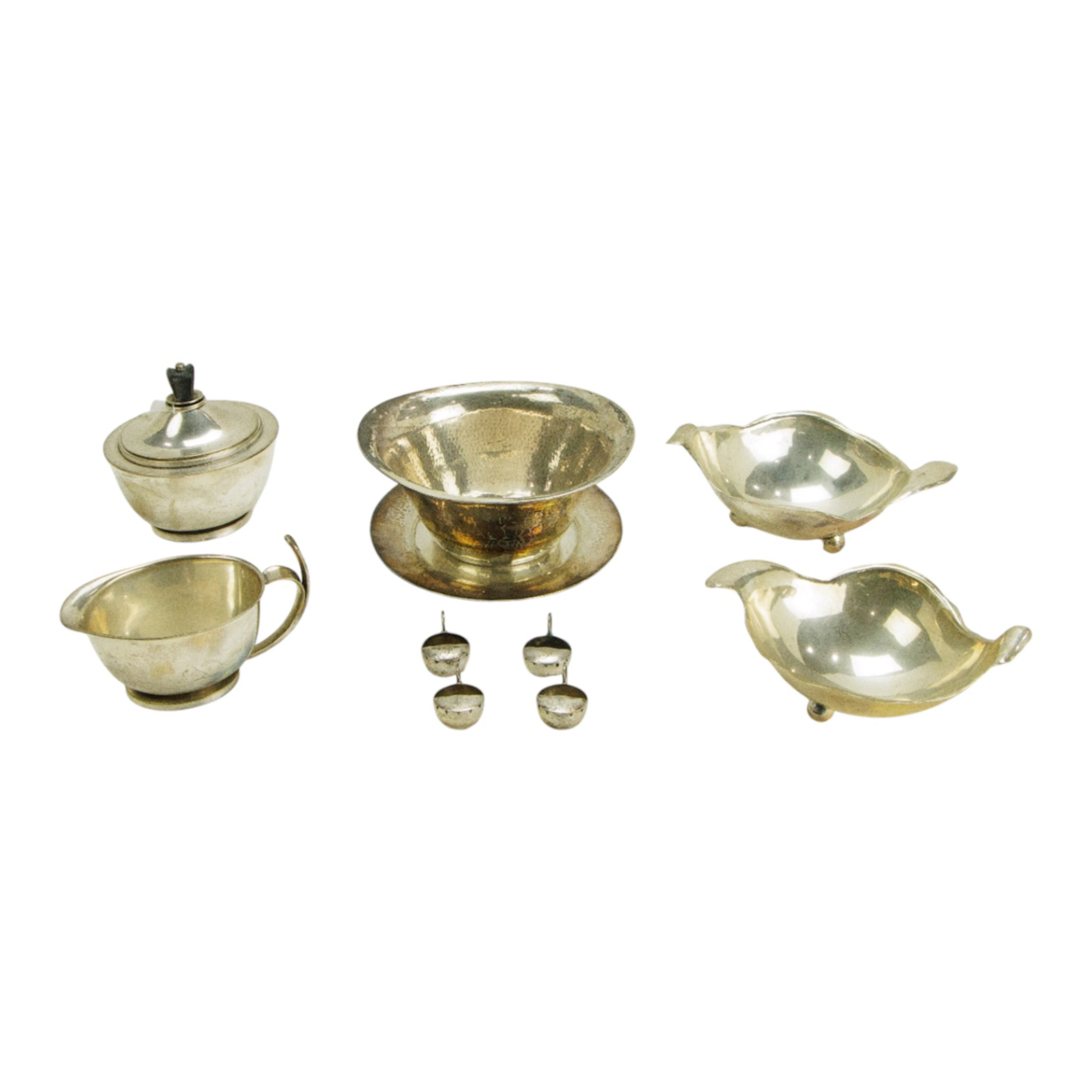 A group of hand wrought silver items