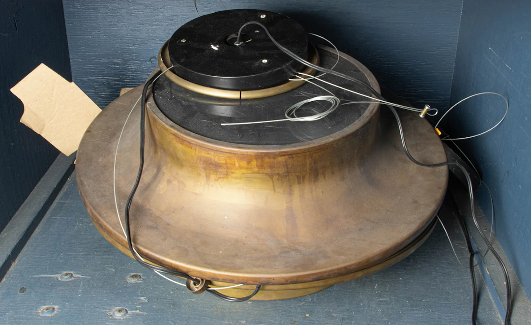 A pair of contemporary burnished brass semi-flush mount ceiling lights