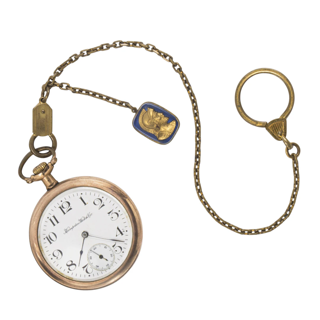 An antique Hampden gold-tone pocket watch and chain