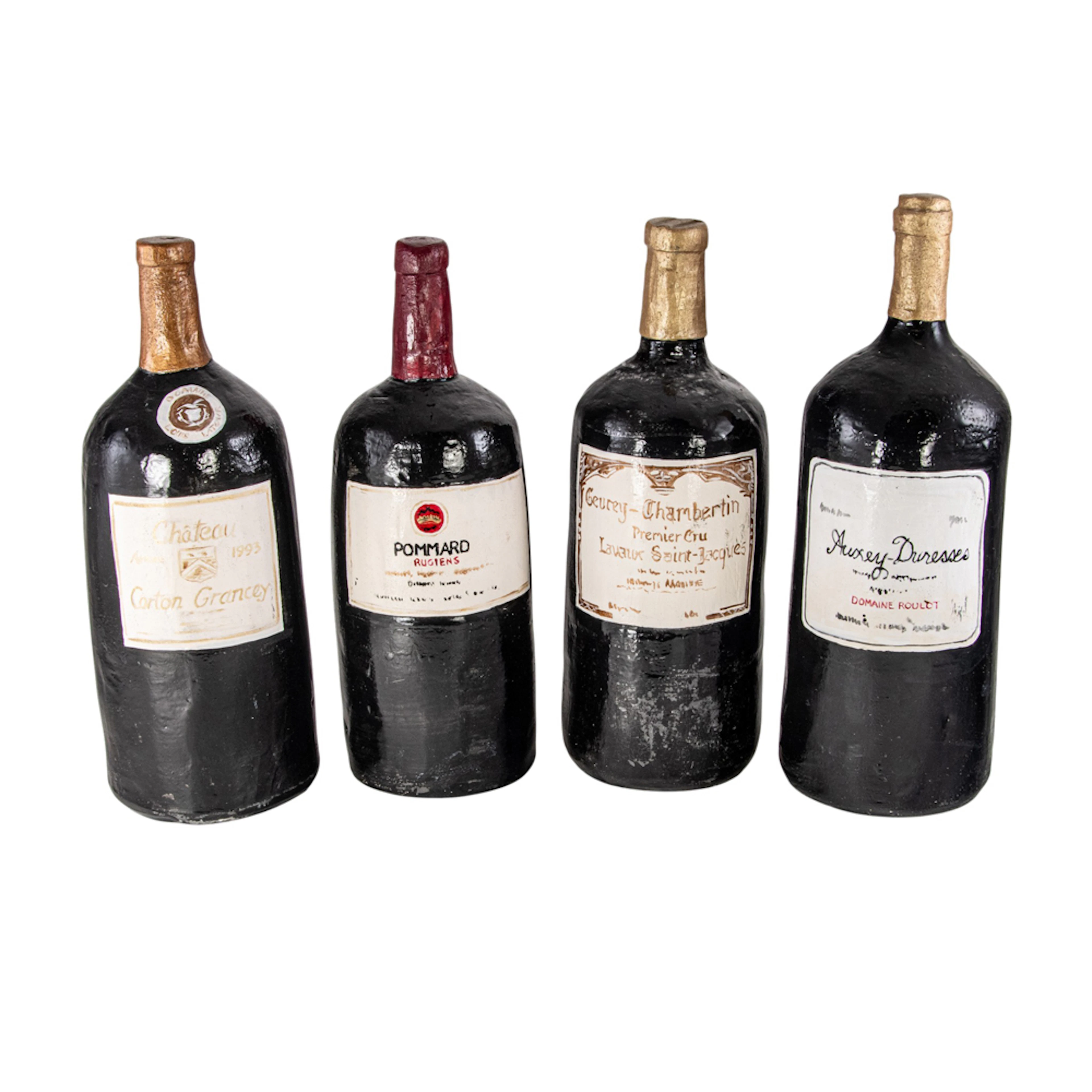 Four ceramic replicas of fine wine bottles