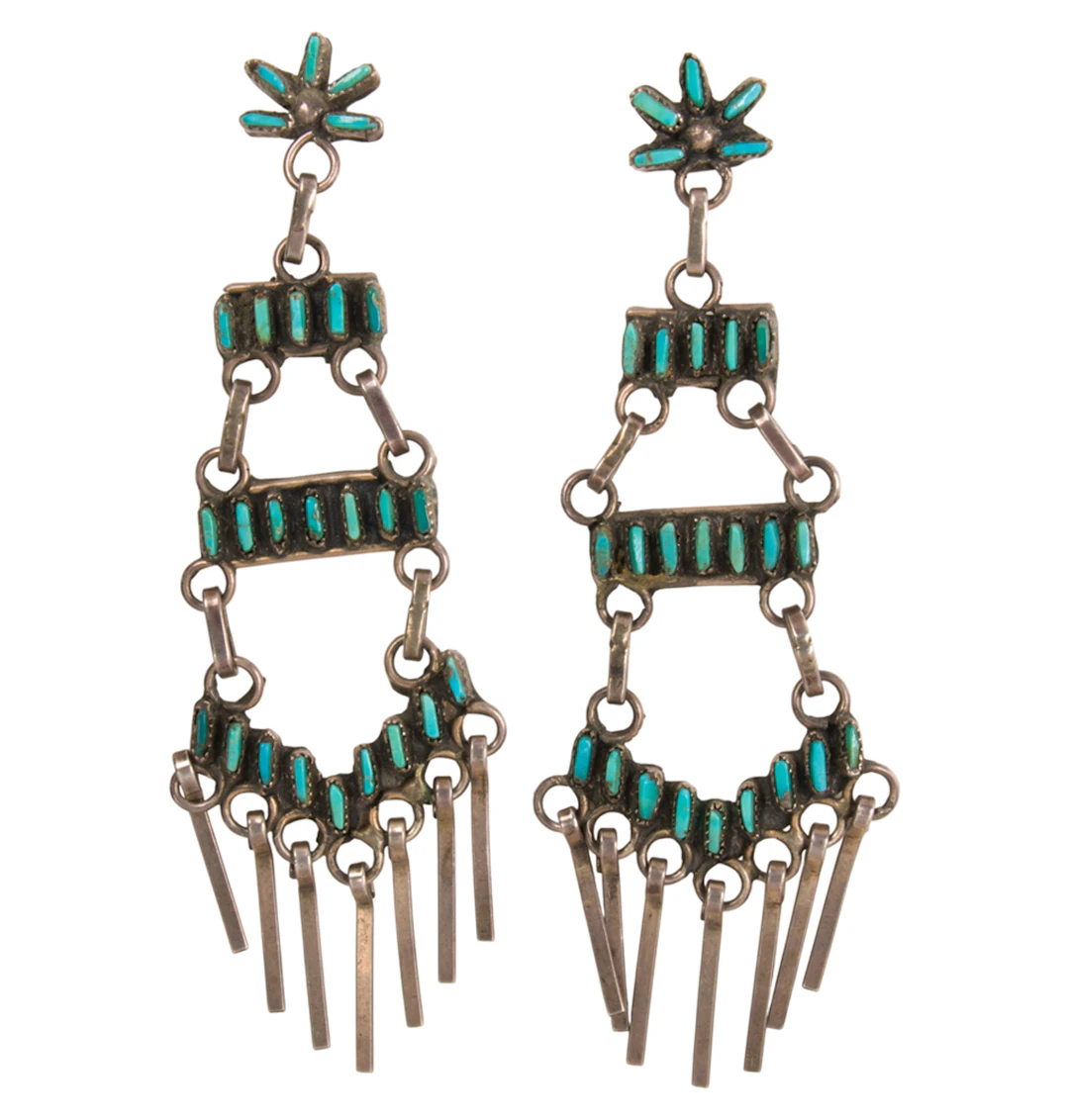 A pair of turquoise and silver earrings