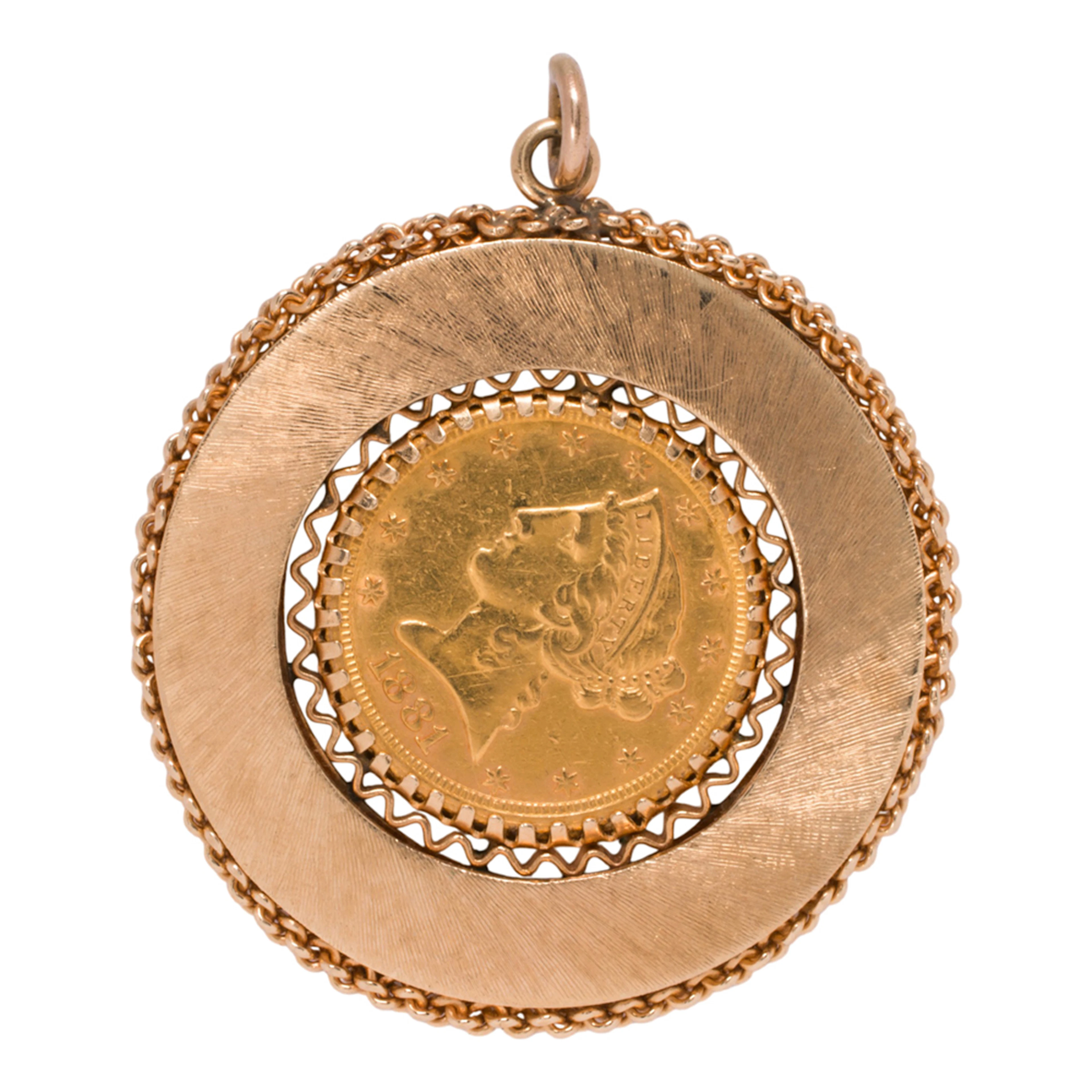 A gold coin and 14k gold pendant