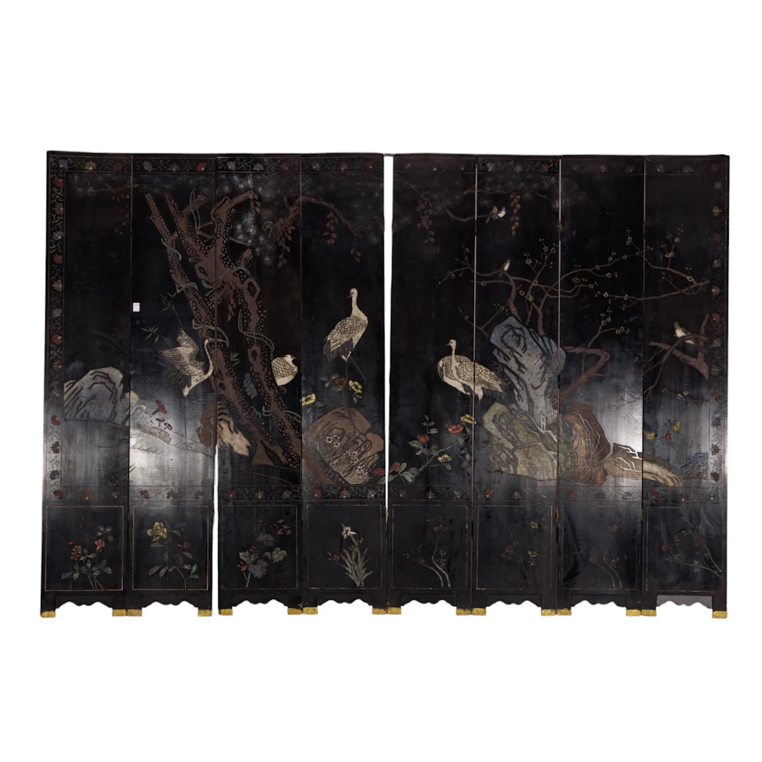 A Chinese eight-panel black lacquer coromandel style folding screen