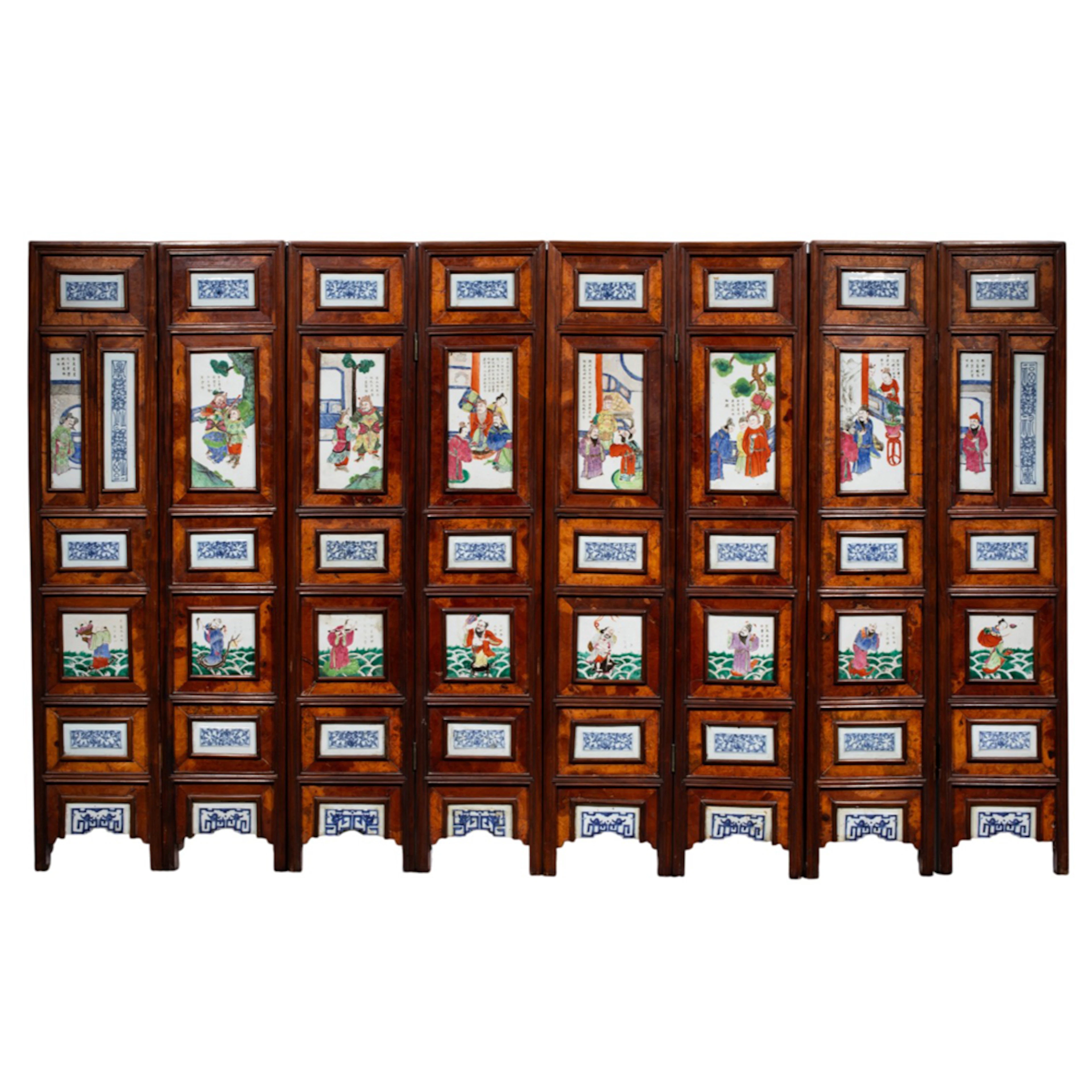 A Chinese porcelain and rosewood eight-panel folding screen