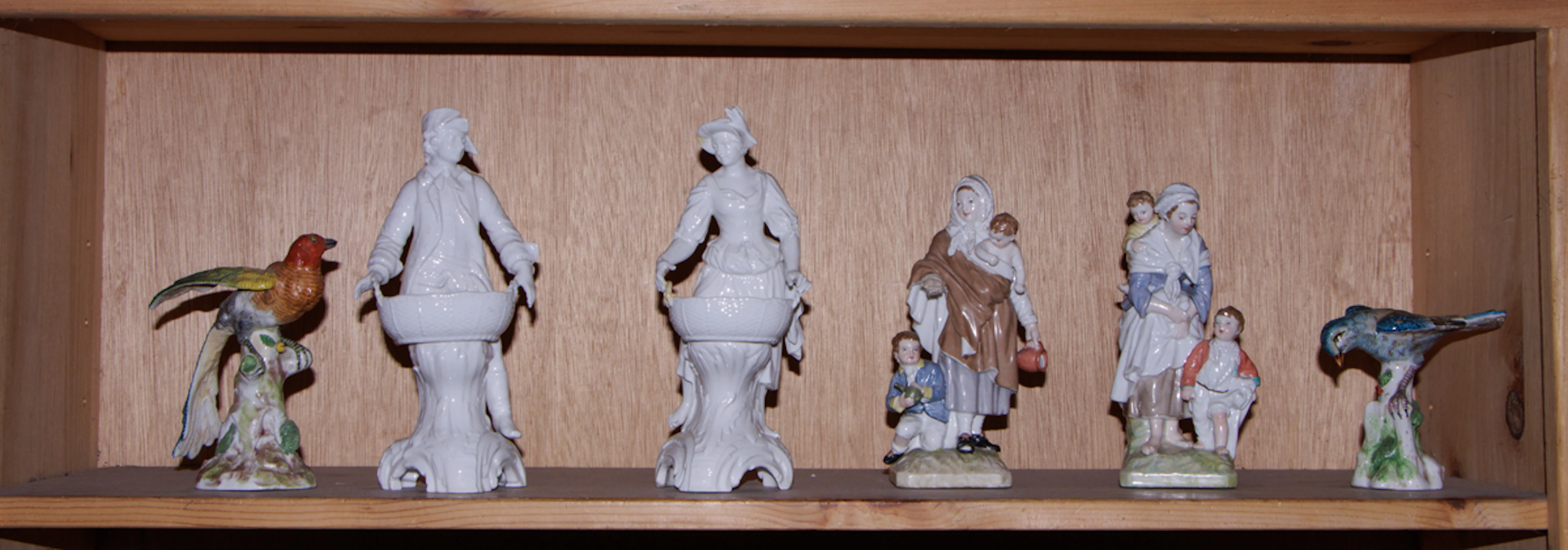 An assembled group of KPM (Berlin) porcelain figures