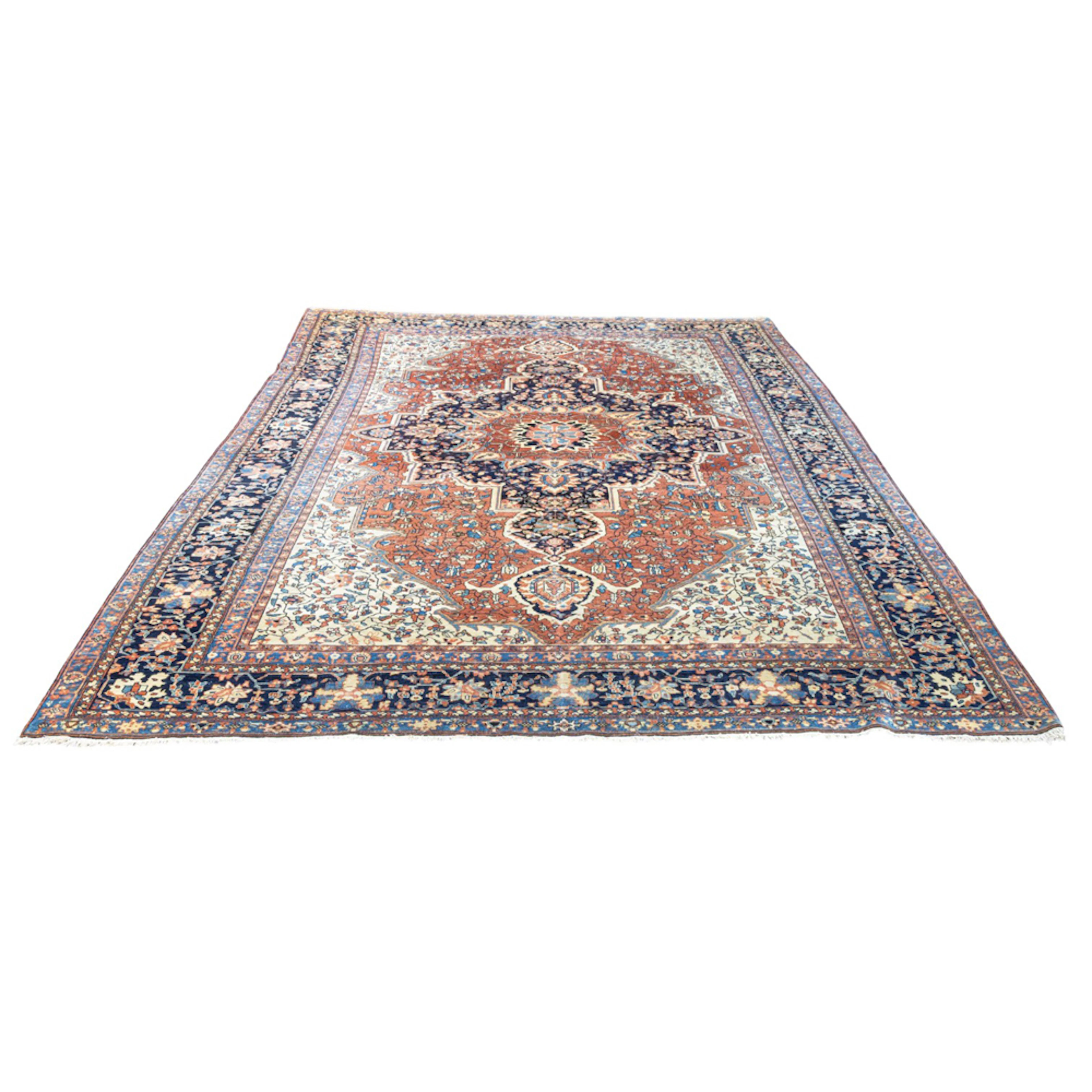 An antique Persian Heriz carpet