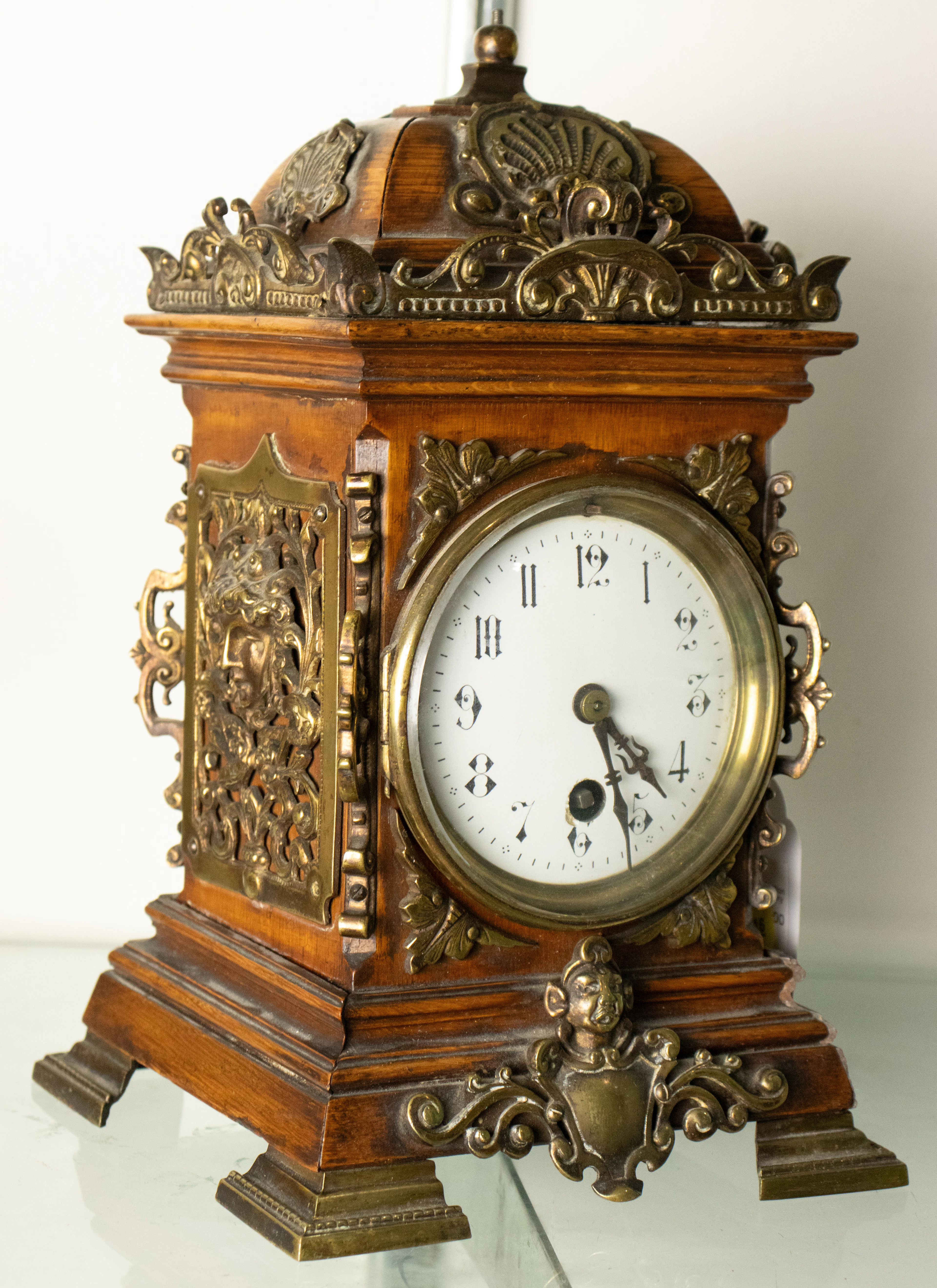A diminutive Renaissance Revival brass mounted clock