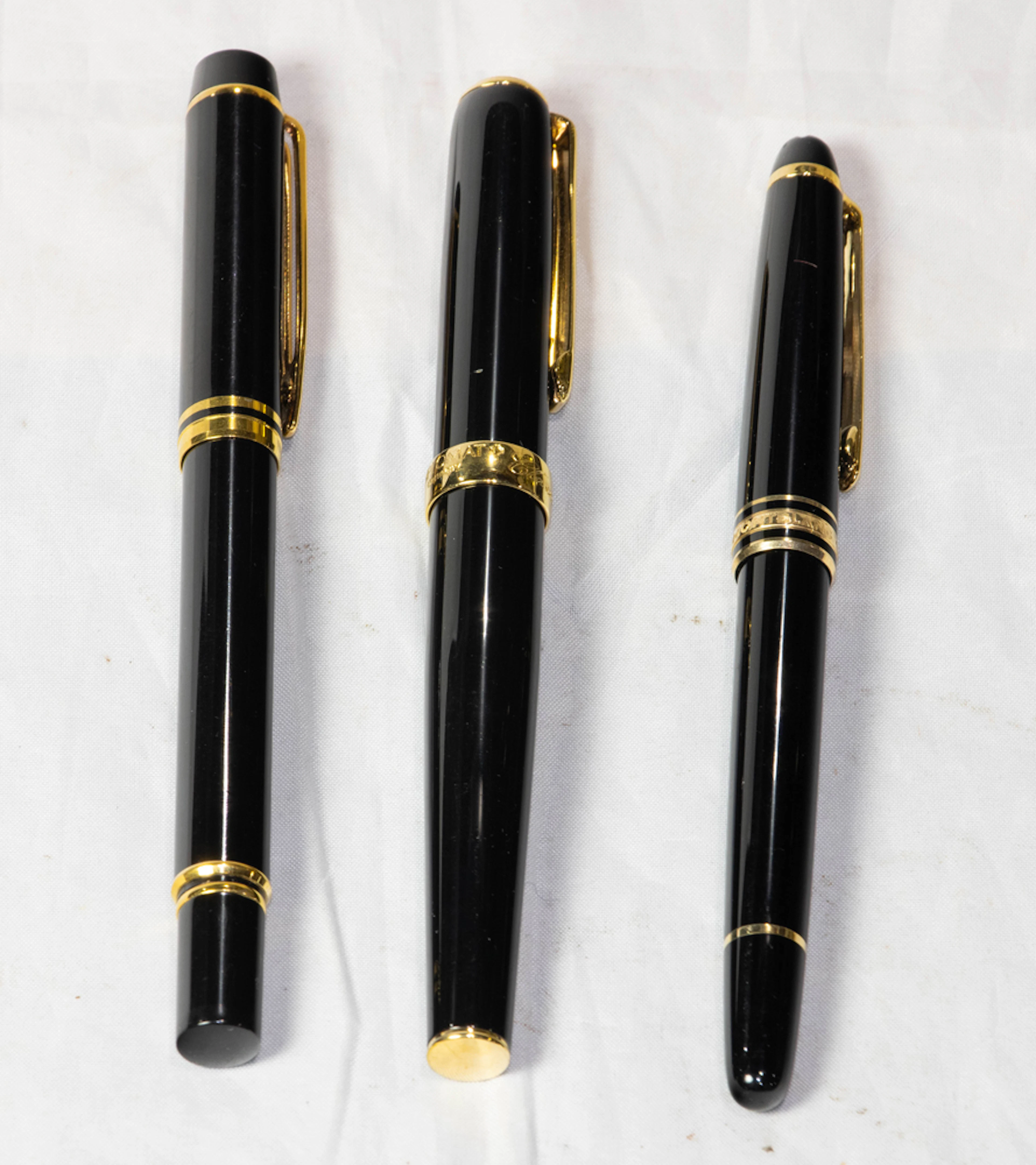 Three writing utensils, including Montblanc, Waterman and Diplomat