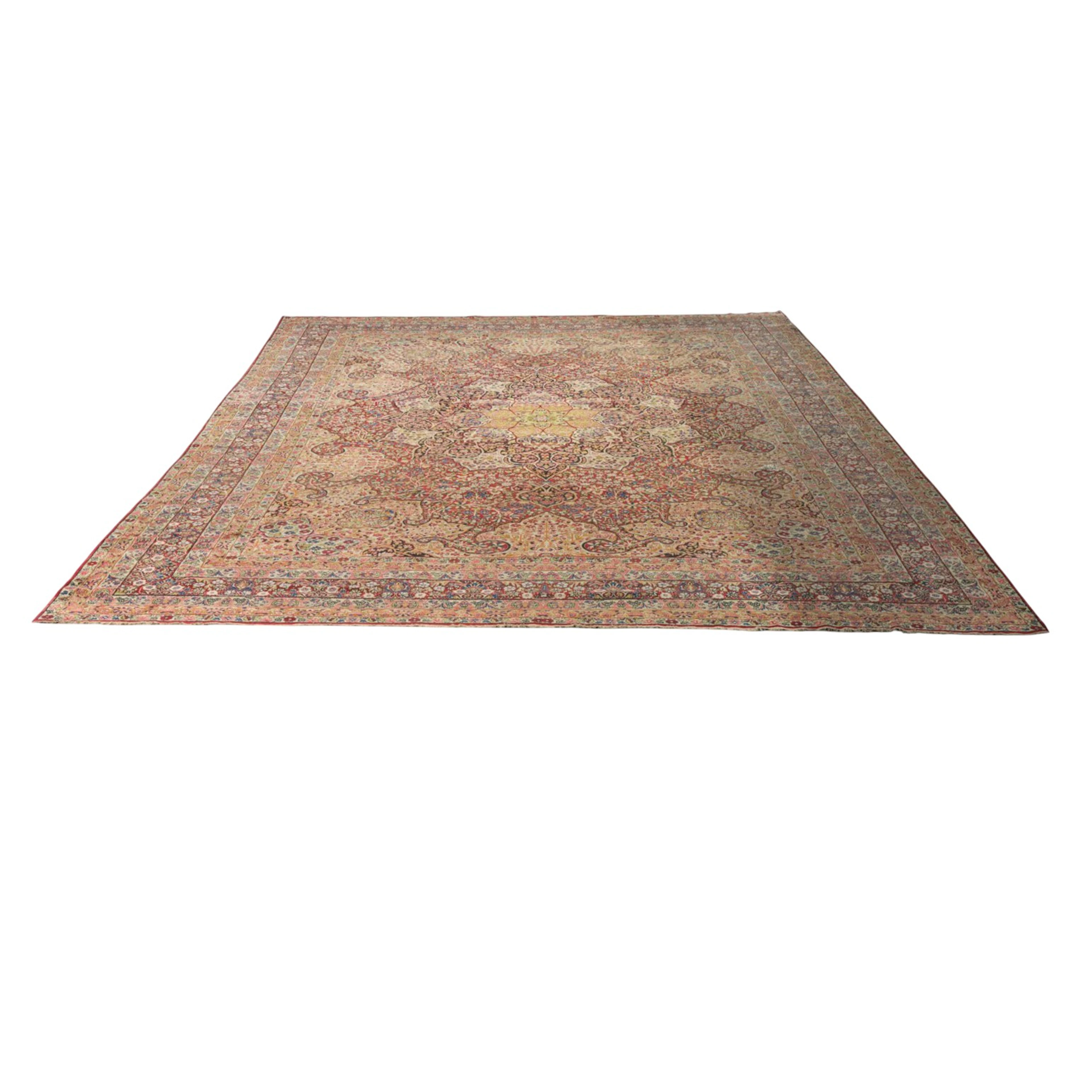 An antique Persian Lavar Kirman carpet