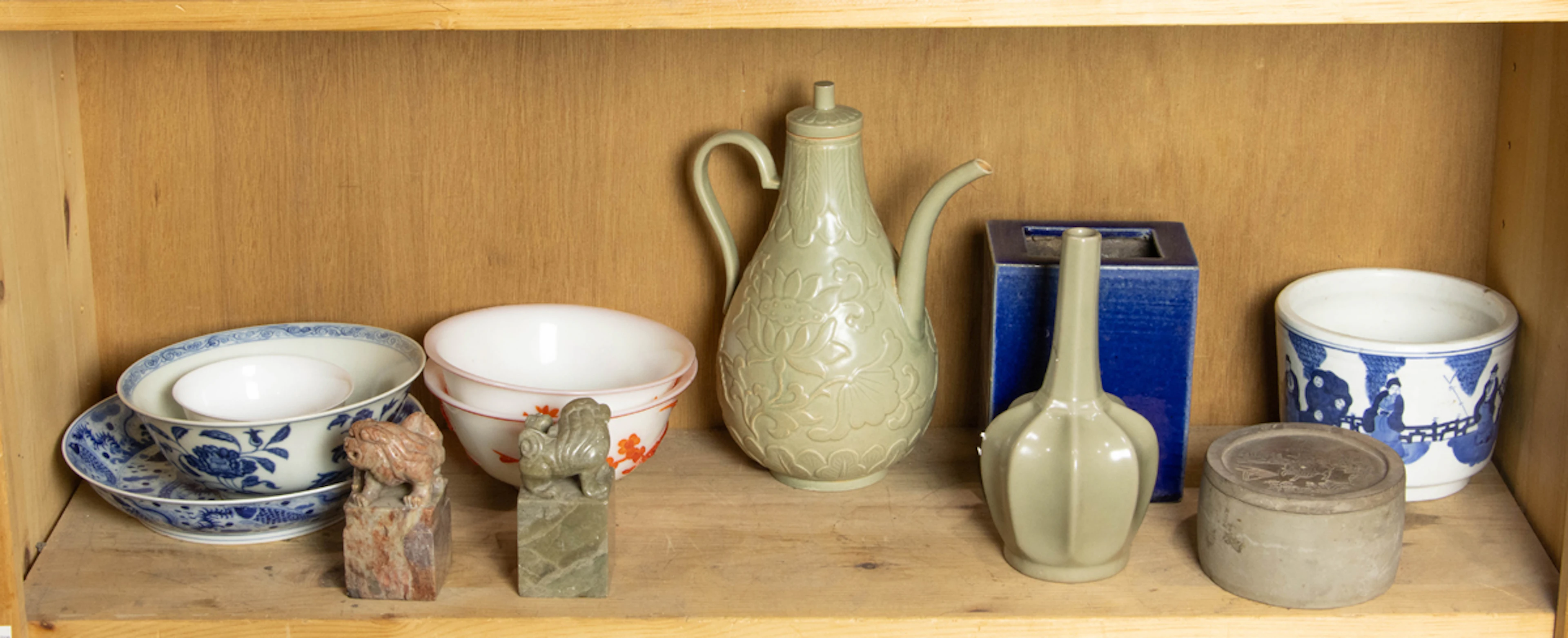A shelf of Chinese decorative objects