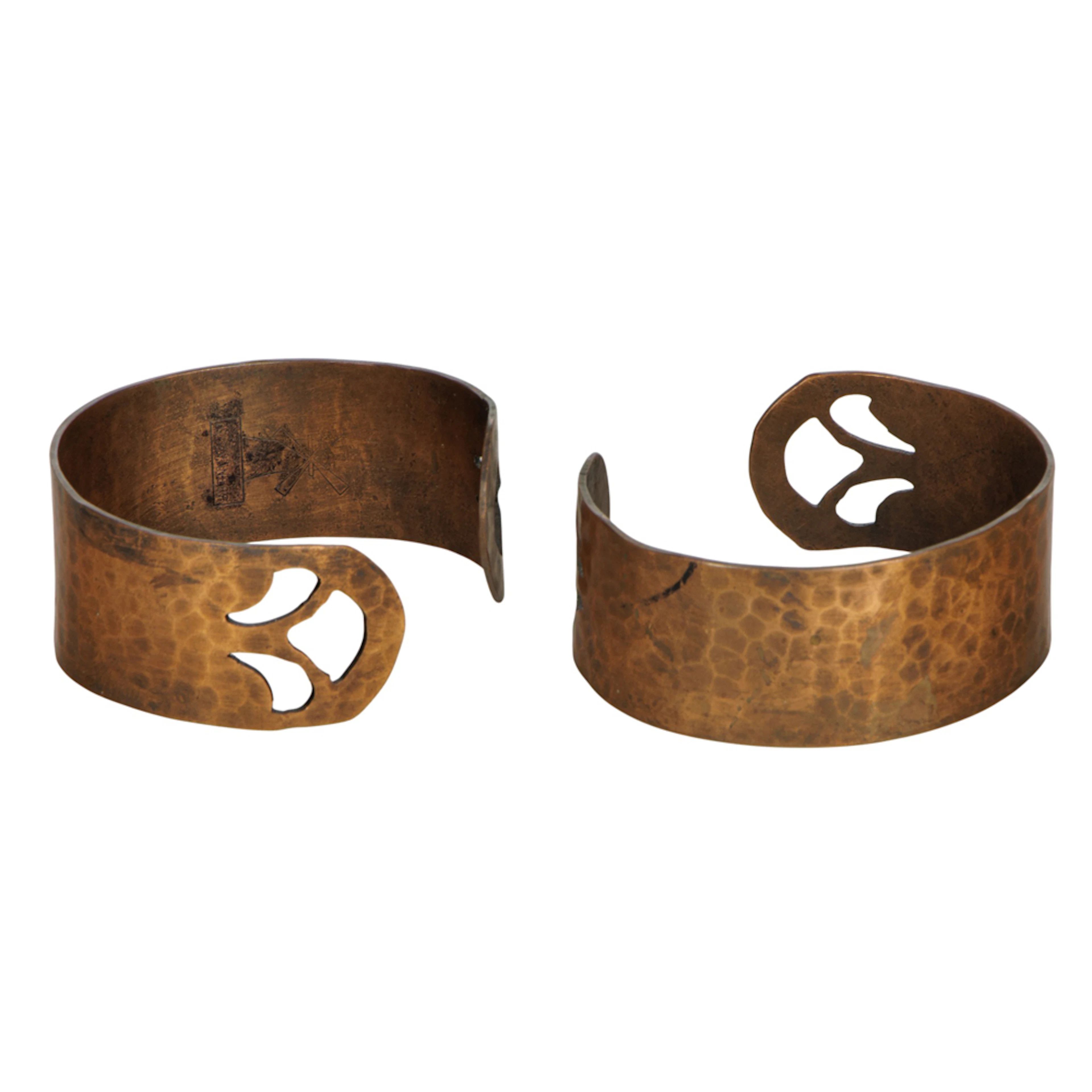 A pair of hammered copper bracelets
