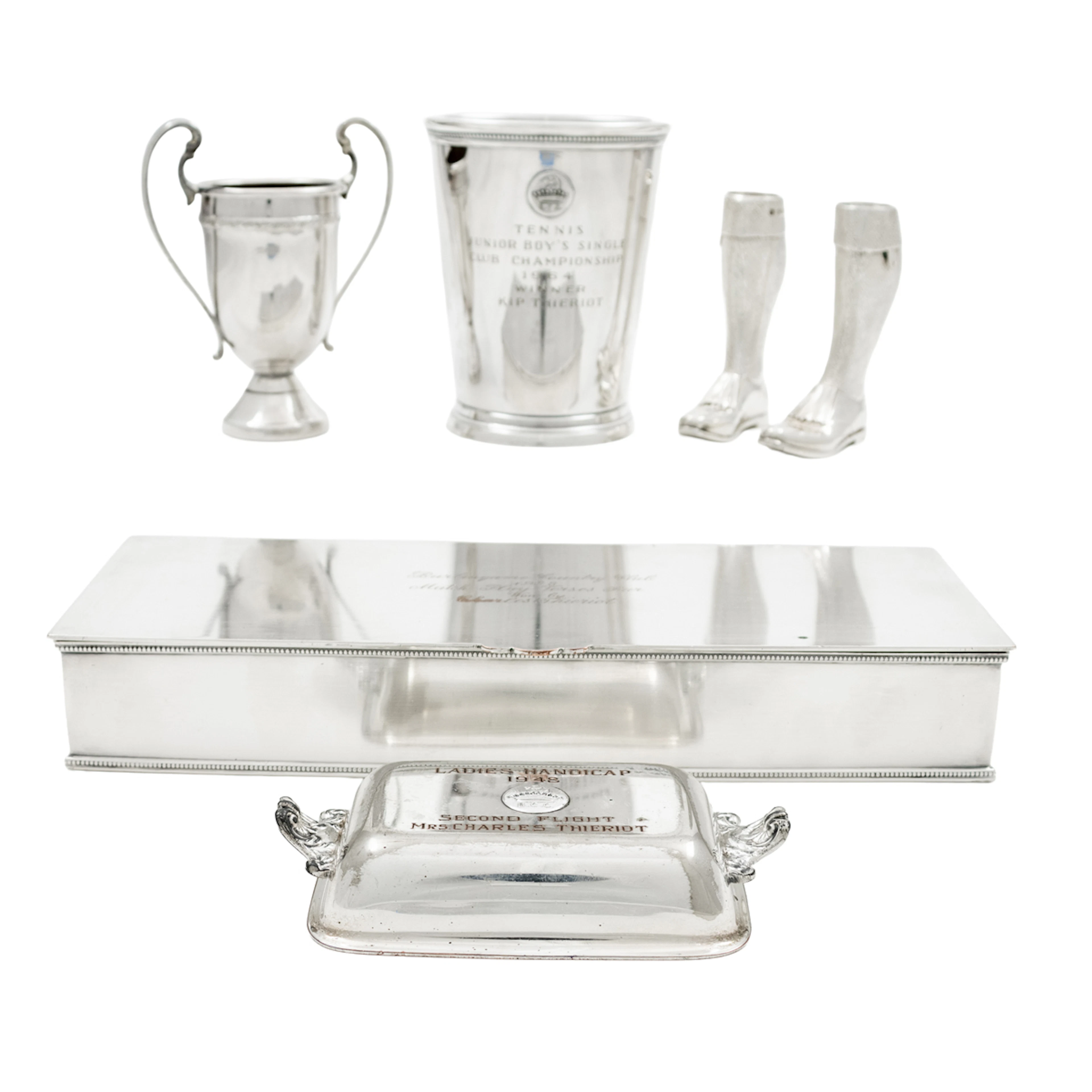 A whimsical pair of English sterling salt and pepper shakers in form