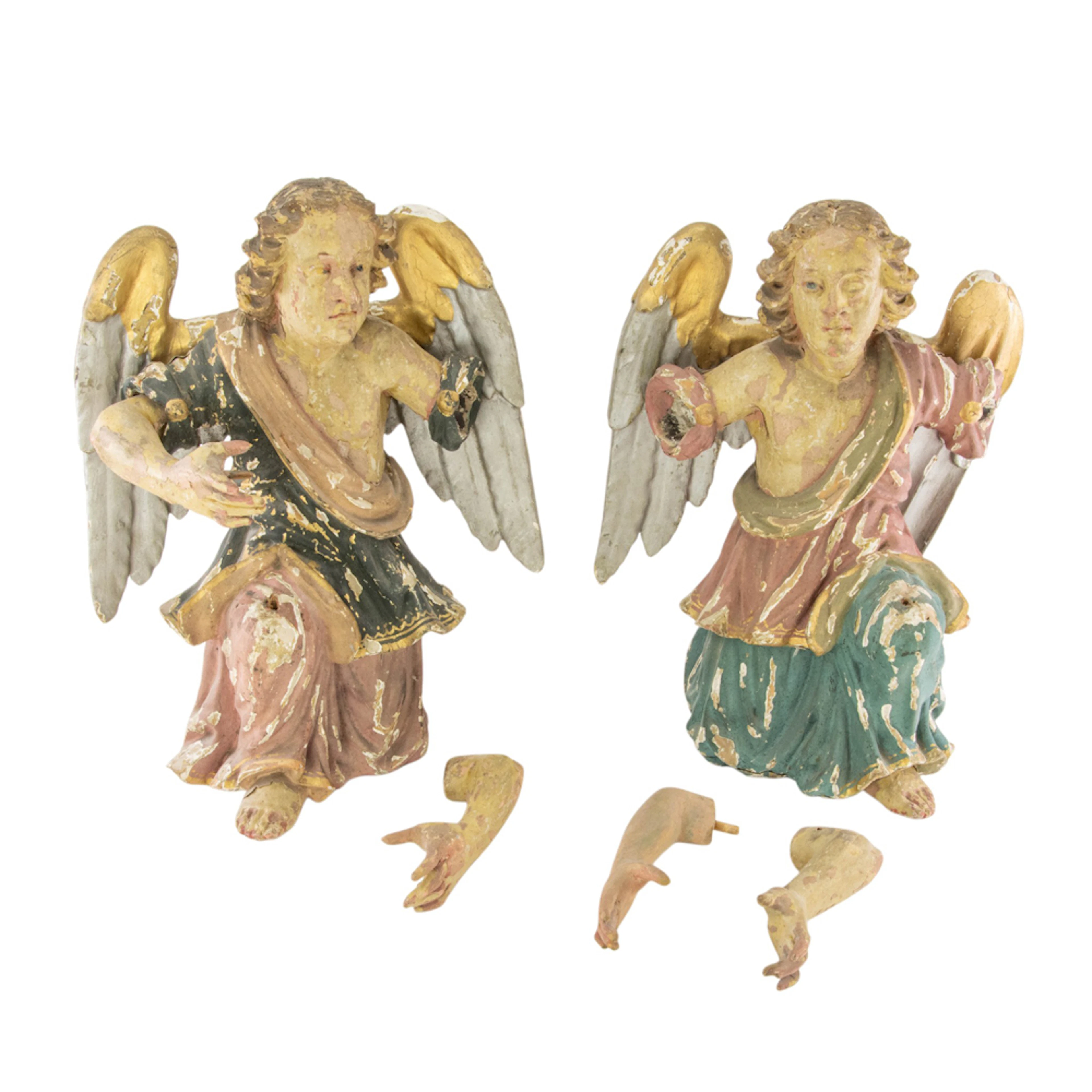 A pair of Continental polychrome carved wood figures of angels