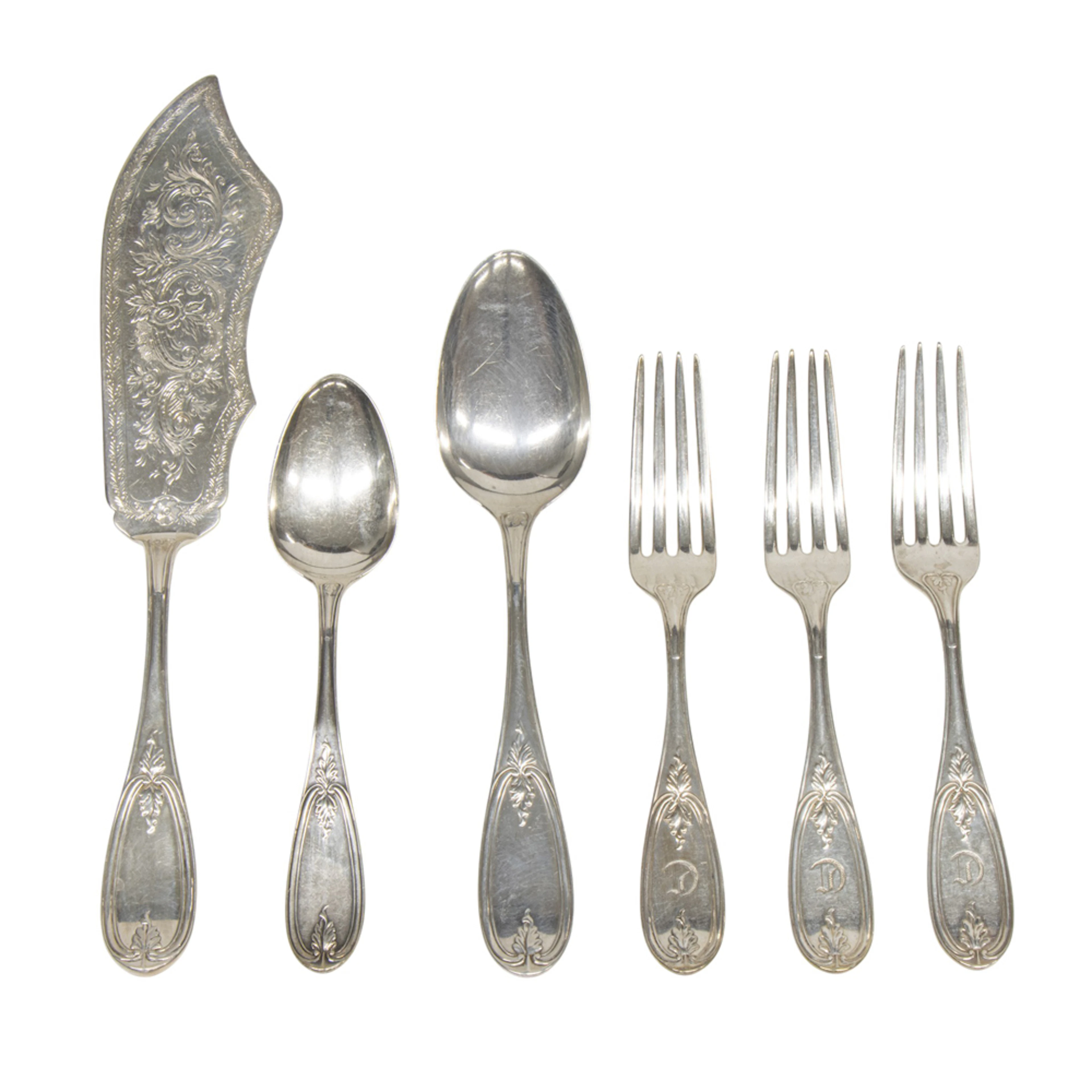 A group of silver flatware in the Olive pattern