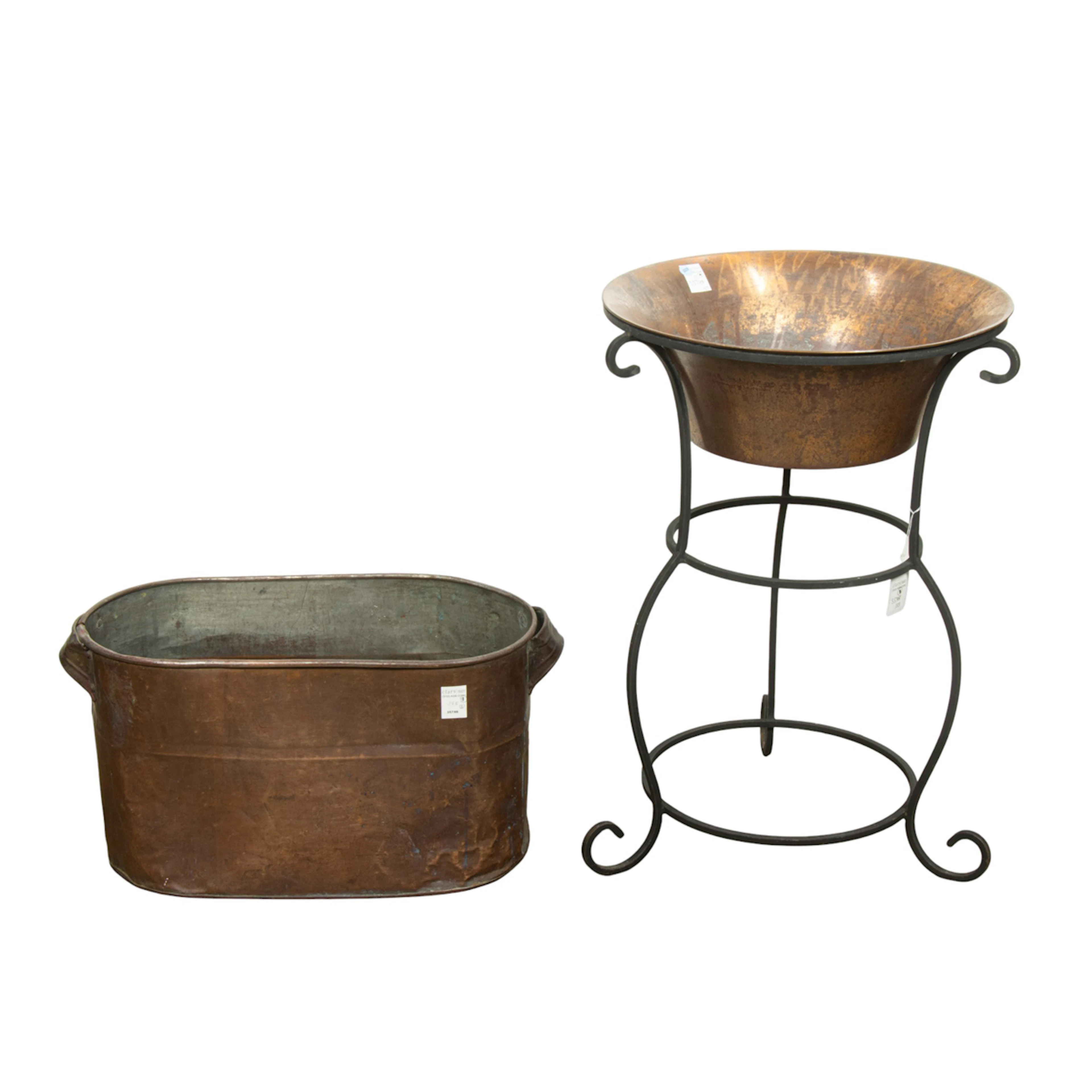 An antique copper footbath and a copper and iron beverage stand