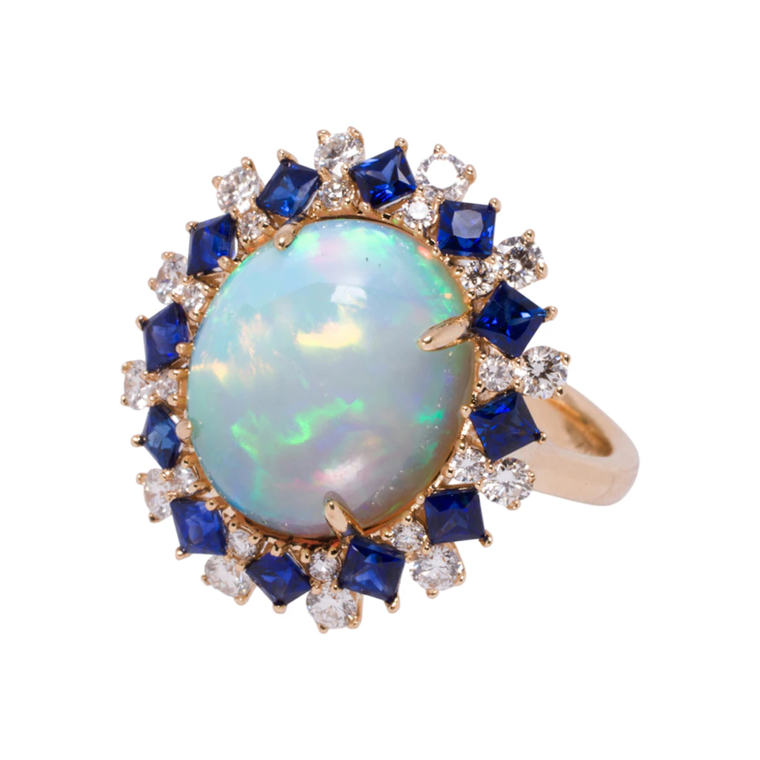 An opal, diamond, sapphire, and 14k gold ring