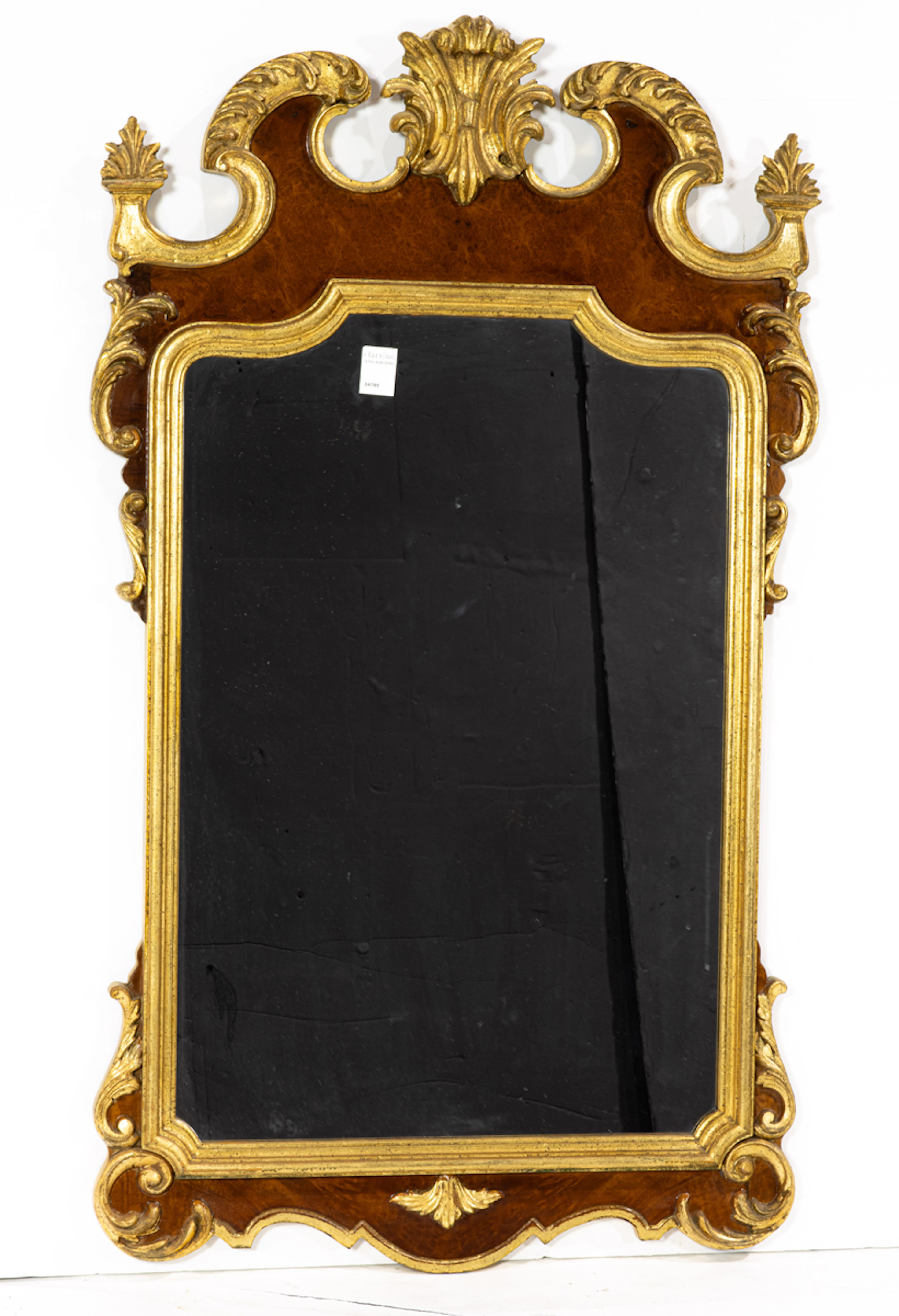 A Transitional parcel gilt burl wood mirror