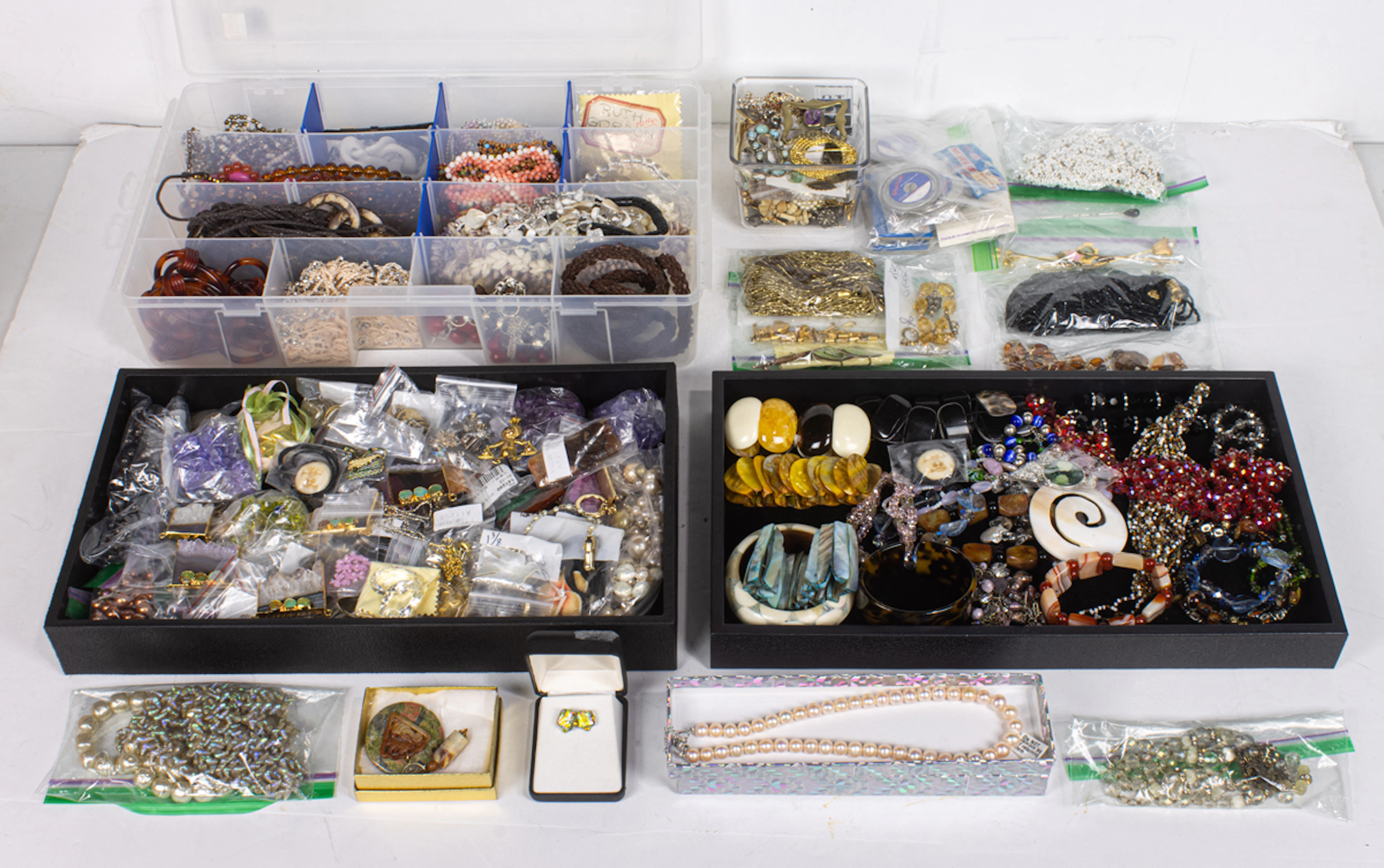 A group of costume jewelry necklaces, bracelets, beads, earrings and