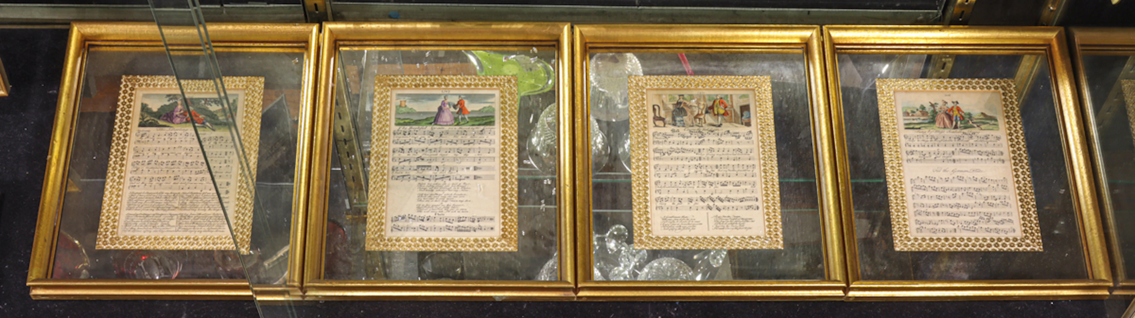 A set of four vintage music sheets