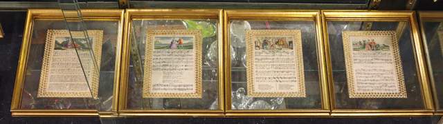A set of four vintage music sheets