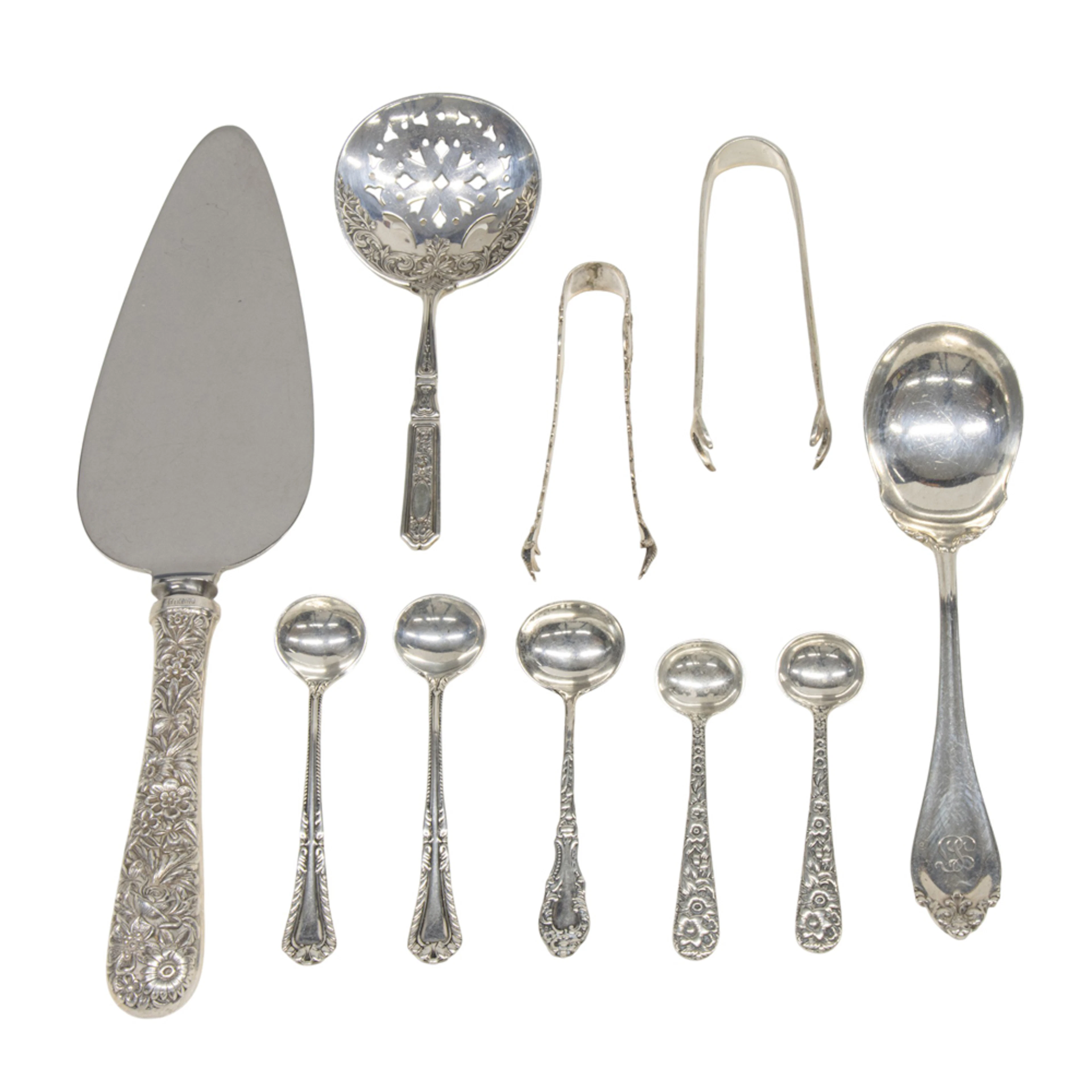 A group of assorted sterling flatware