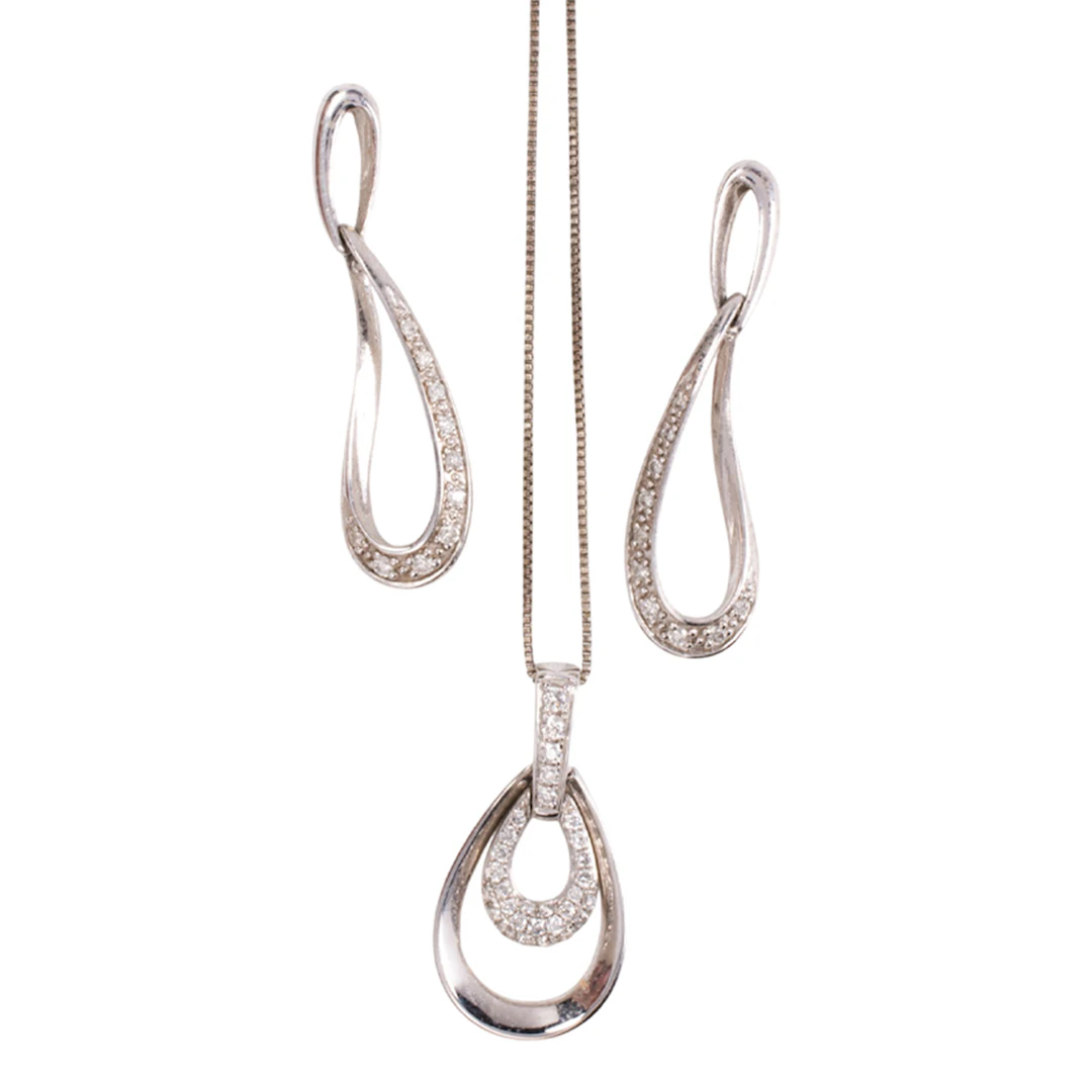 A diamond and 18k white gold pendant with 10k white gold earrings