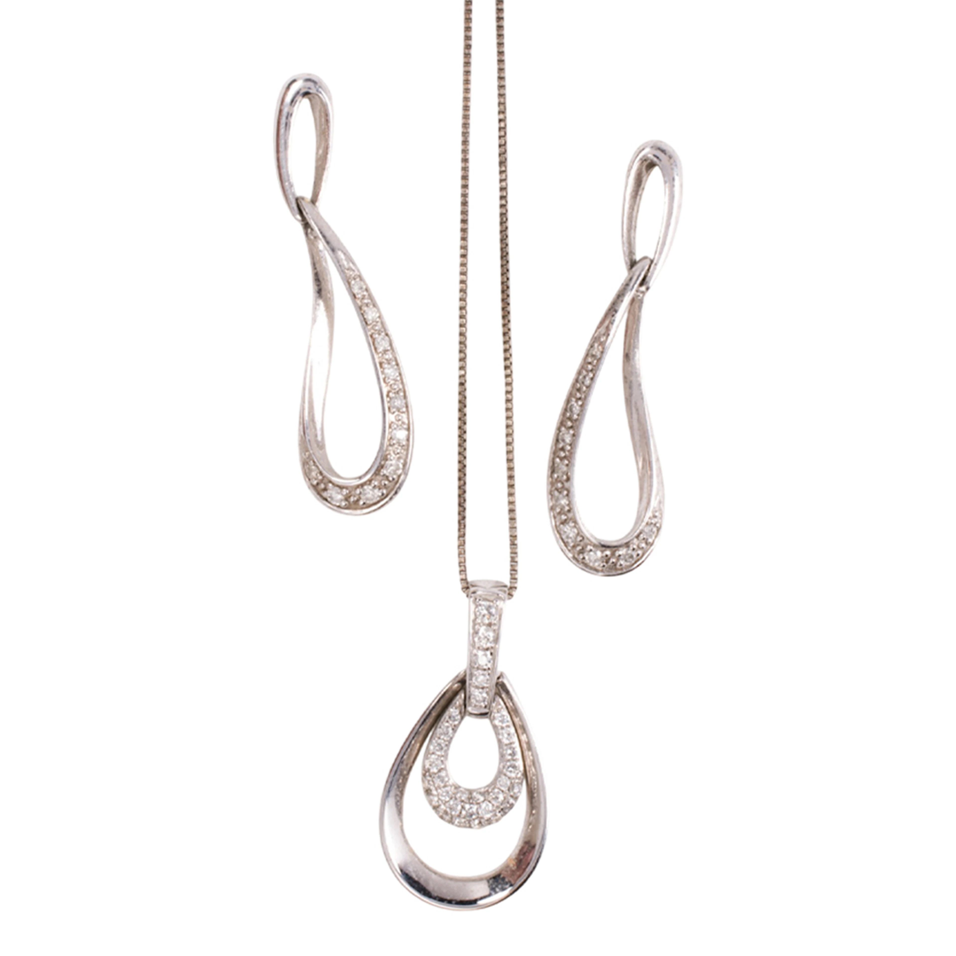 A diamond and 18k white gold pendant with 10k white gold earrings