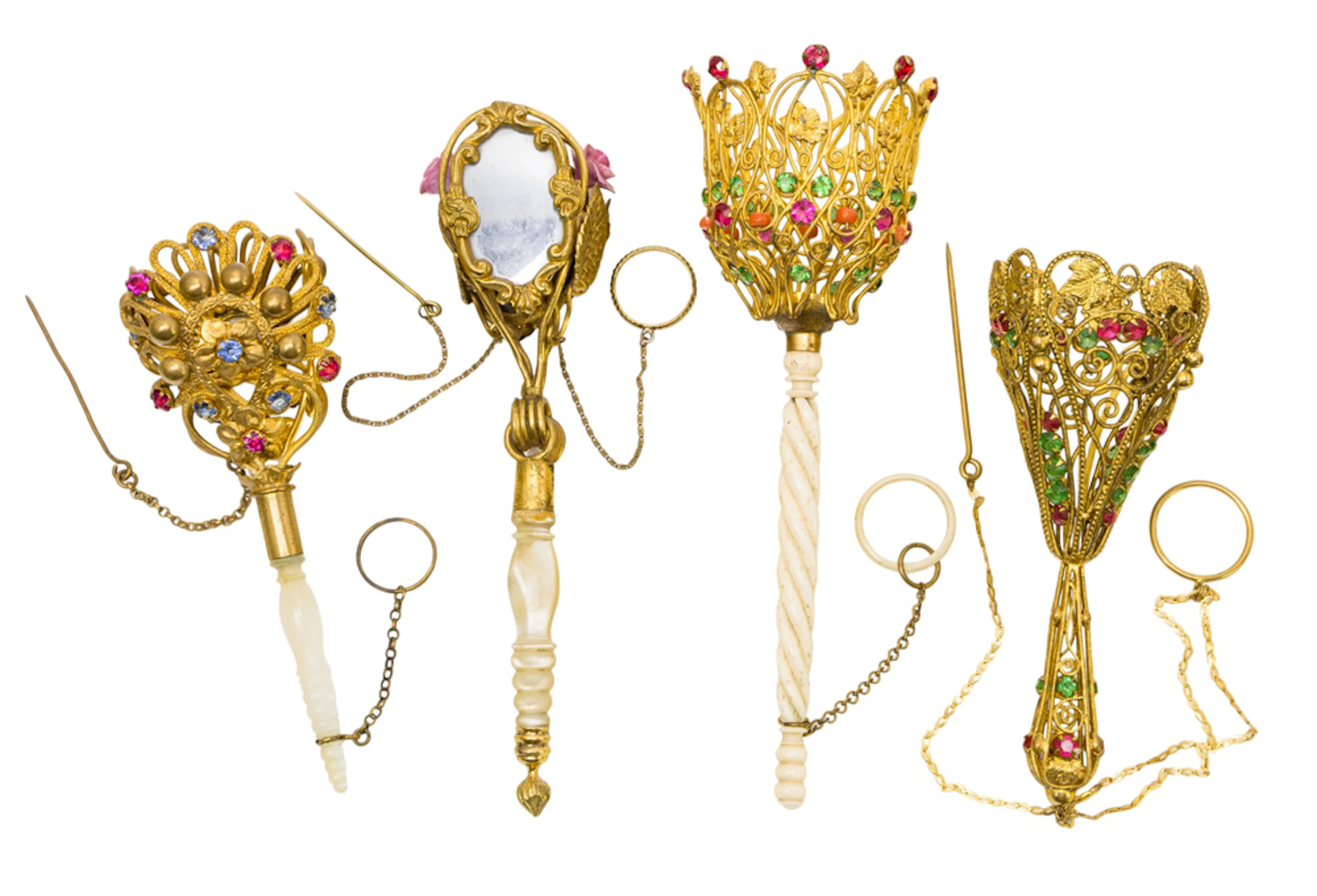 Four English gilt metal posy holders or tussie mussies