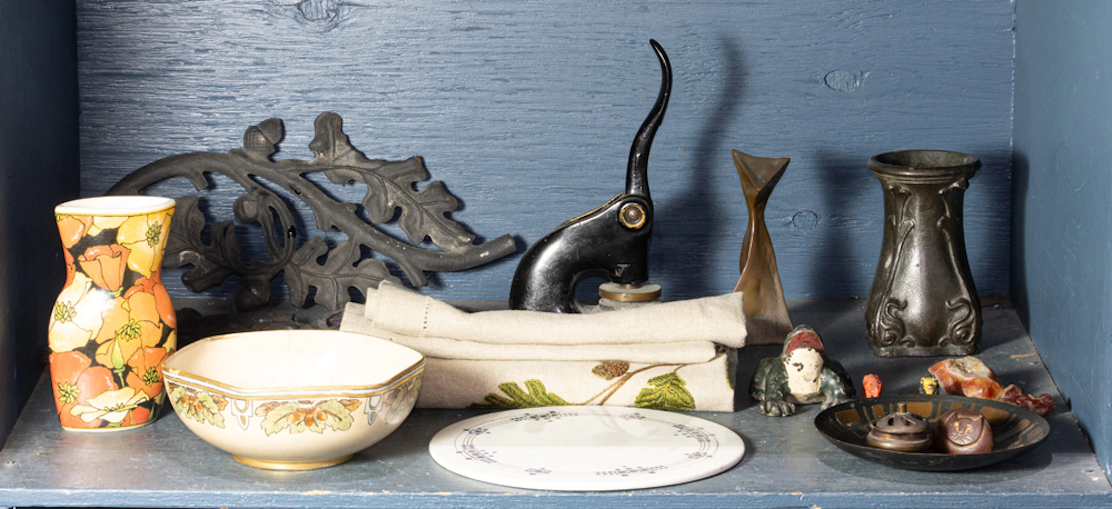 An assembled group of metal and ceramic table articles