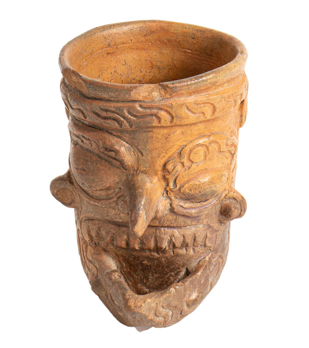 A Mayan plumbate cup depicting a bearded head