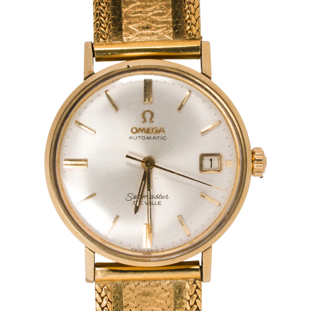 An Omega Seamaster Deville 18k gold watch