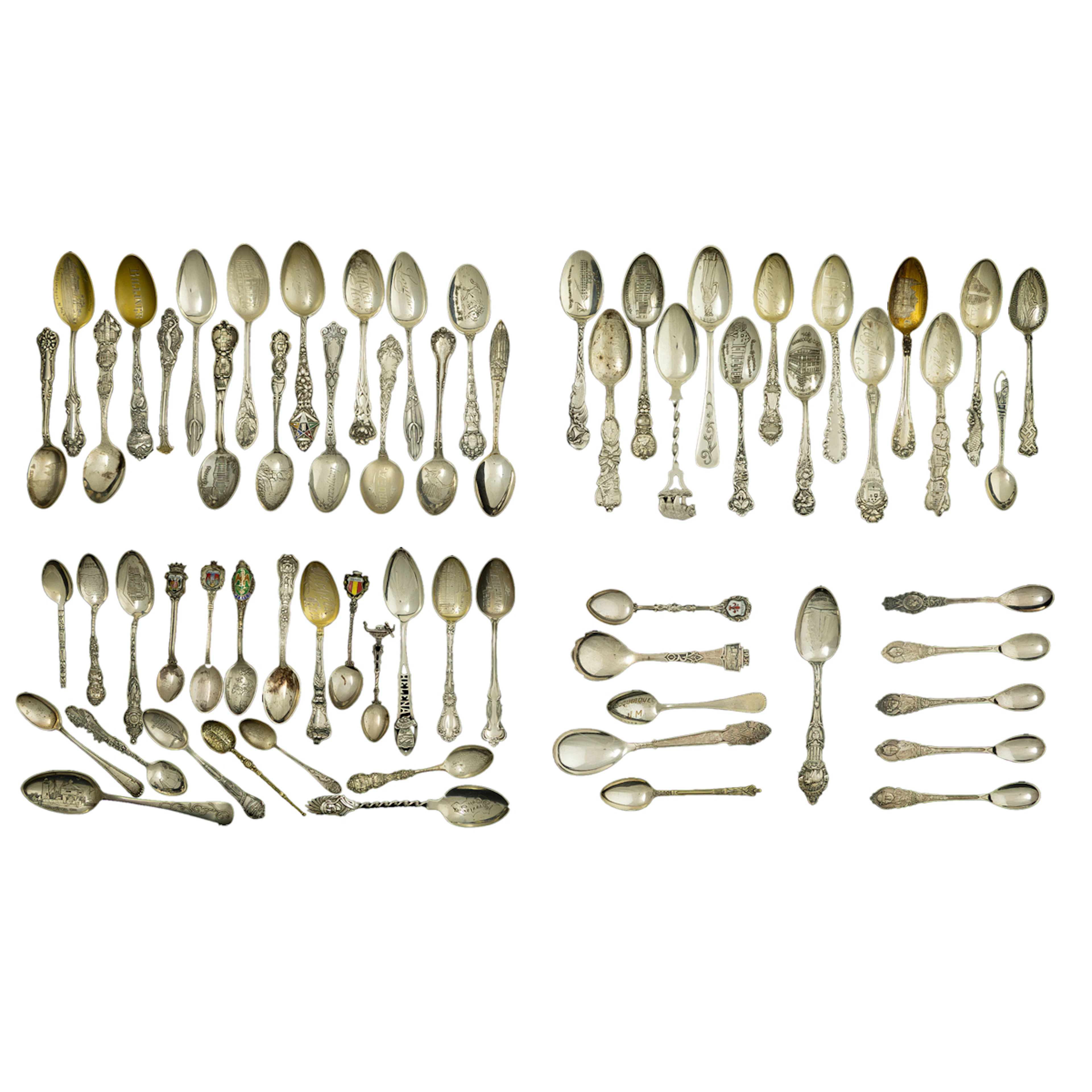 A collection of souvenier spoons in sterling and silverplate
