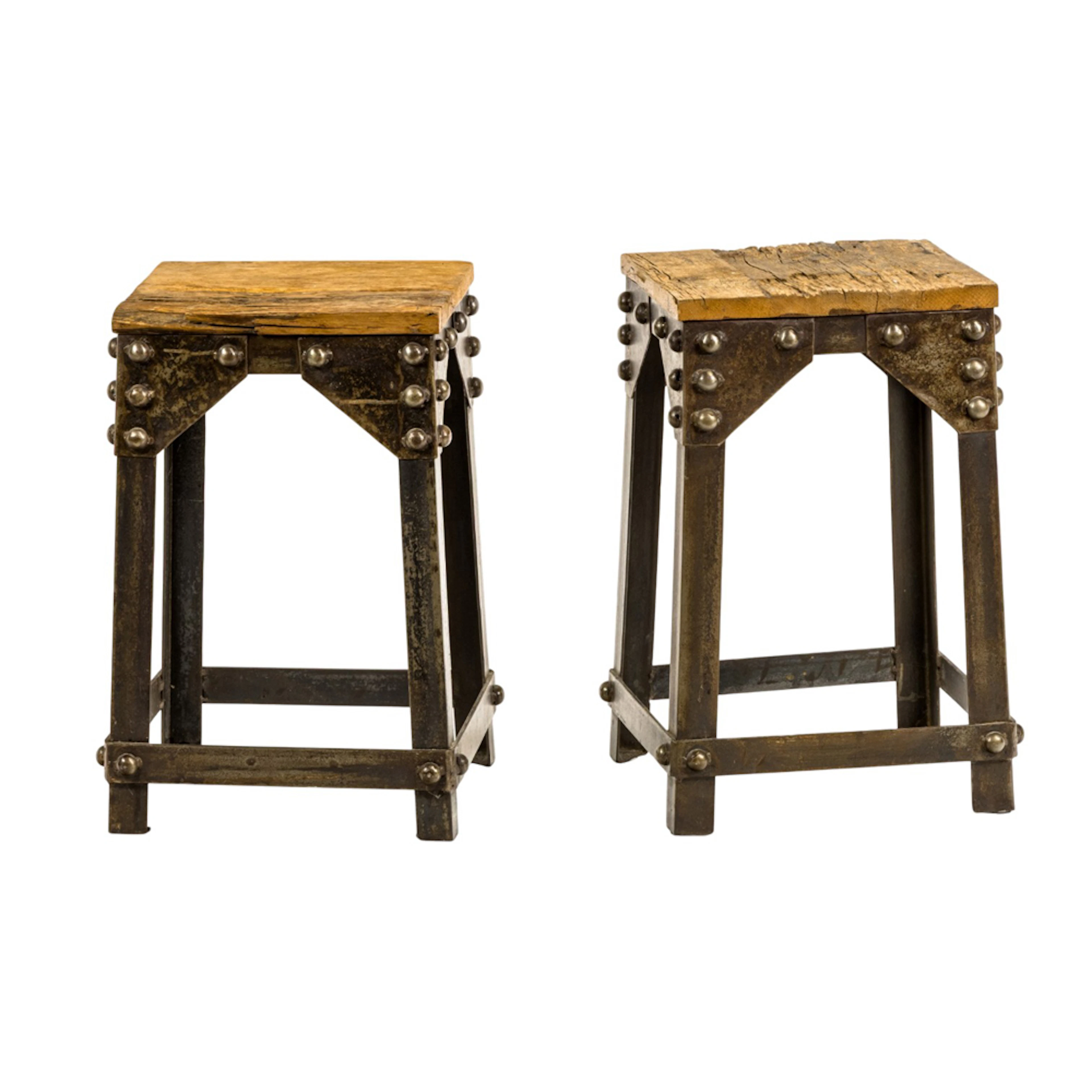 A pair of Industrial style iron and reclaimed wood stools