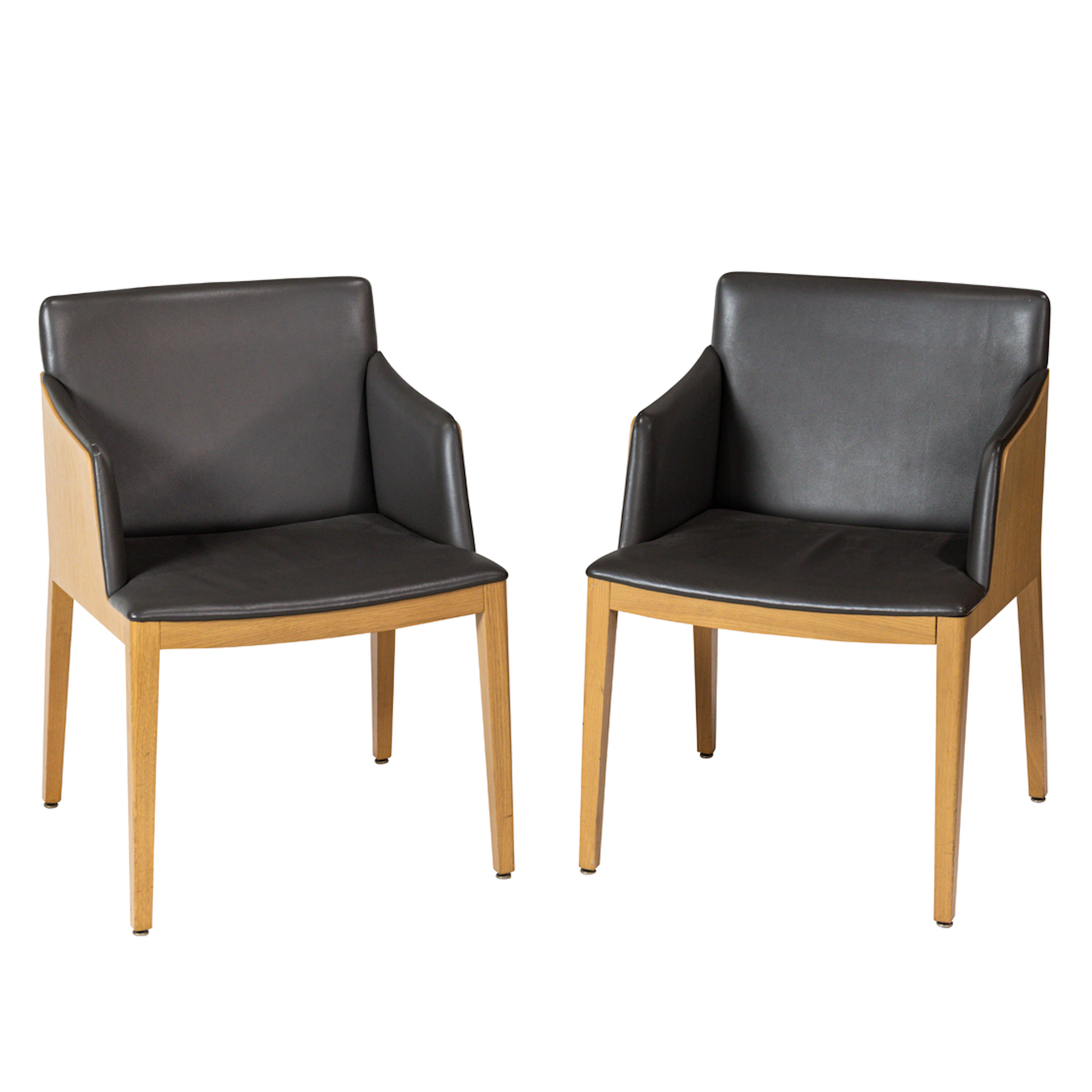 A pair of Poltrona Frau leather upholstered 'Poltroncina Beatrice' armchairs