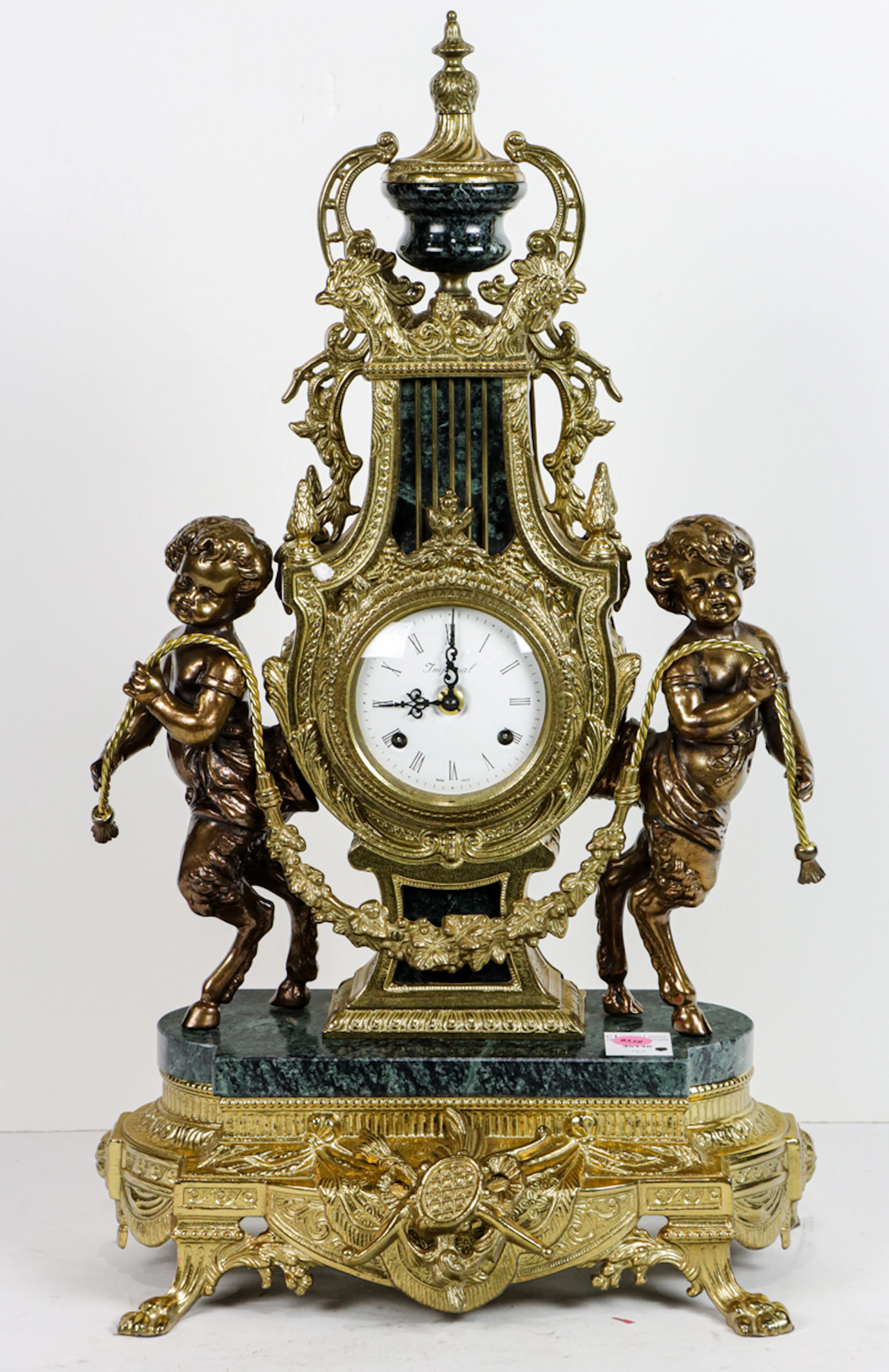 A Contemporary Neoclassical style brass mounted marble figural lyre form clock