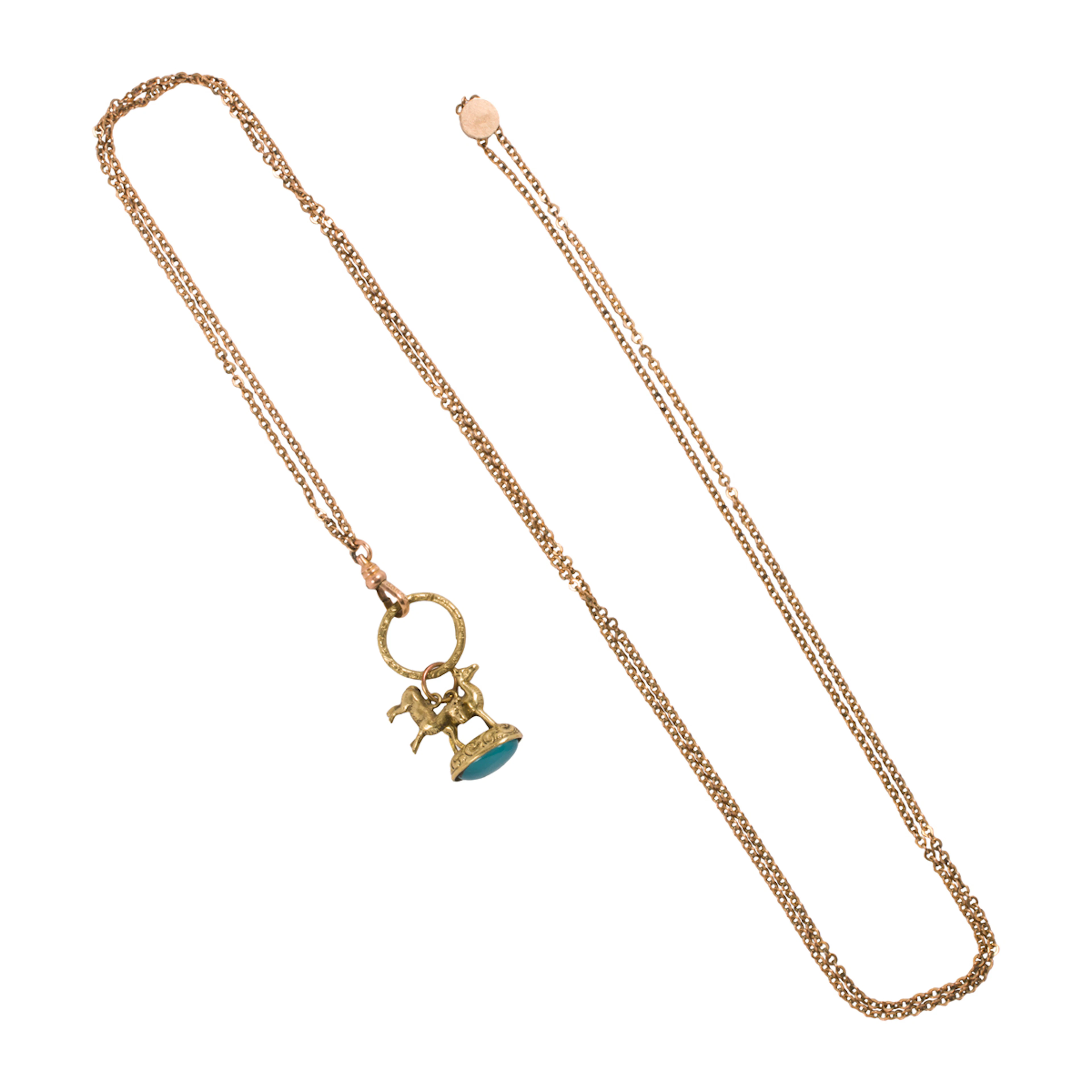 A gold-filled watch chain and fob
