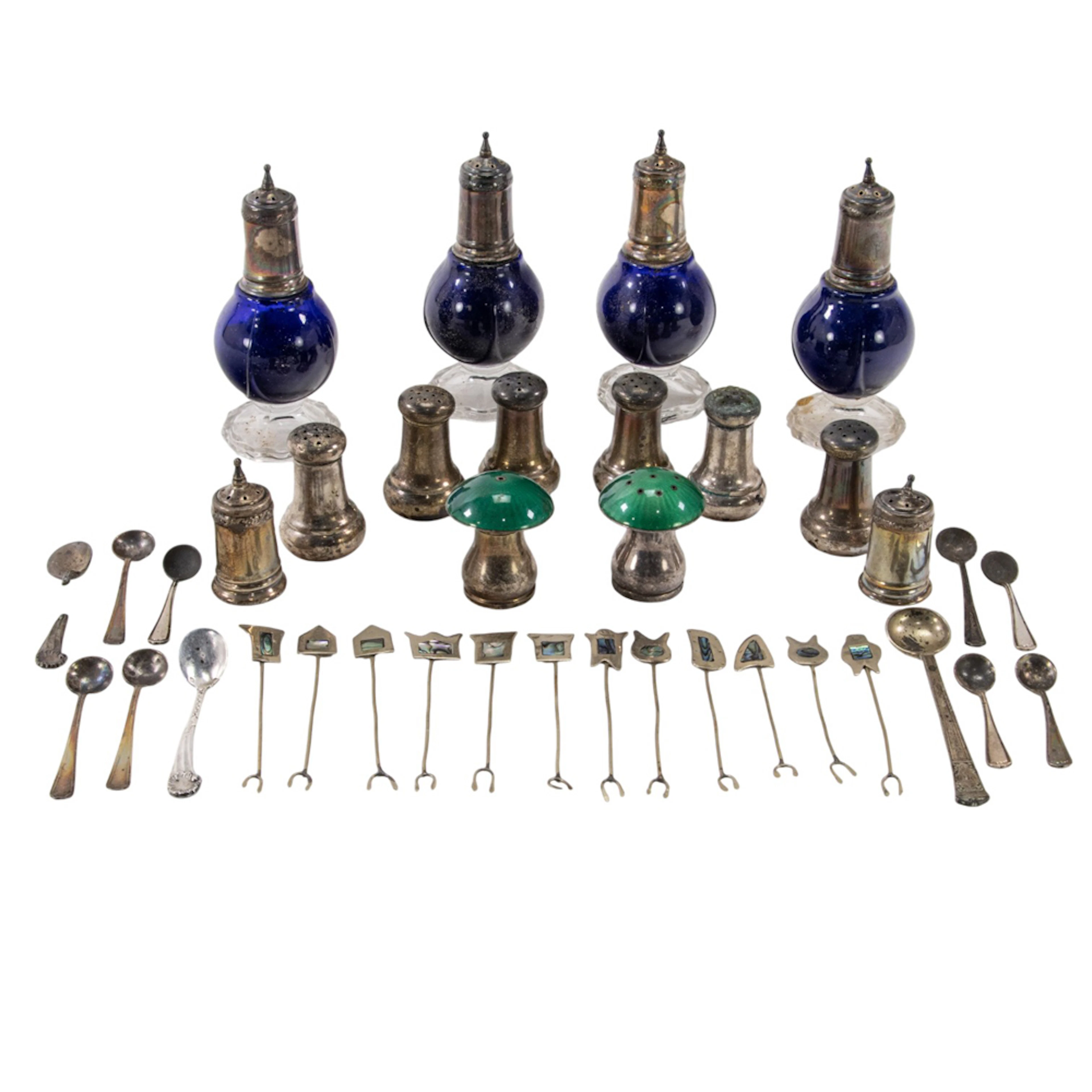 A quantity of sterling and sterling mounted casters, salt spoons, etc