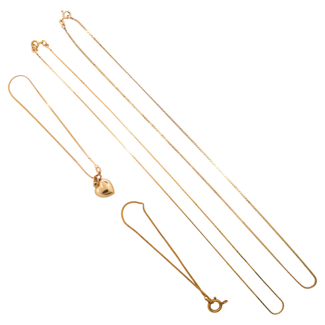 A group of 14k gold chains