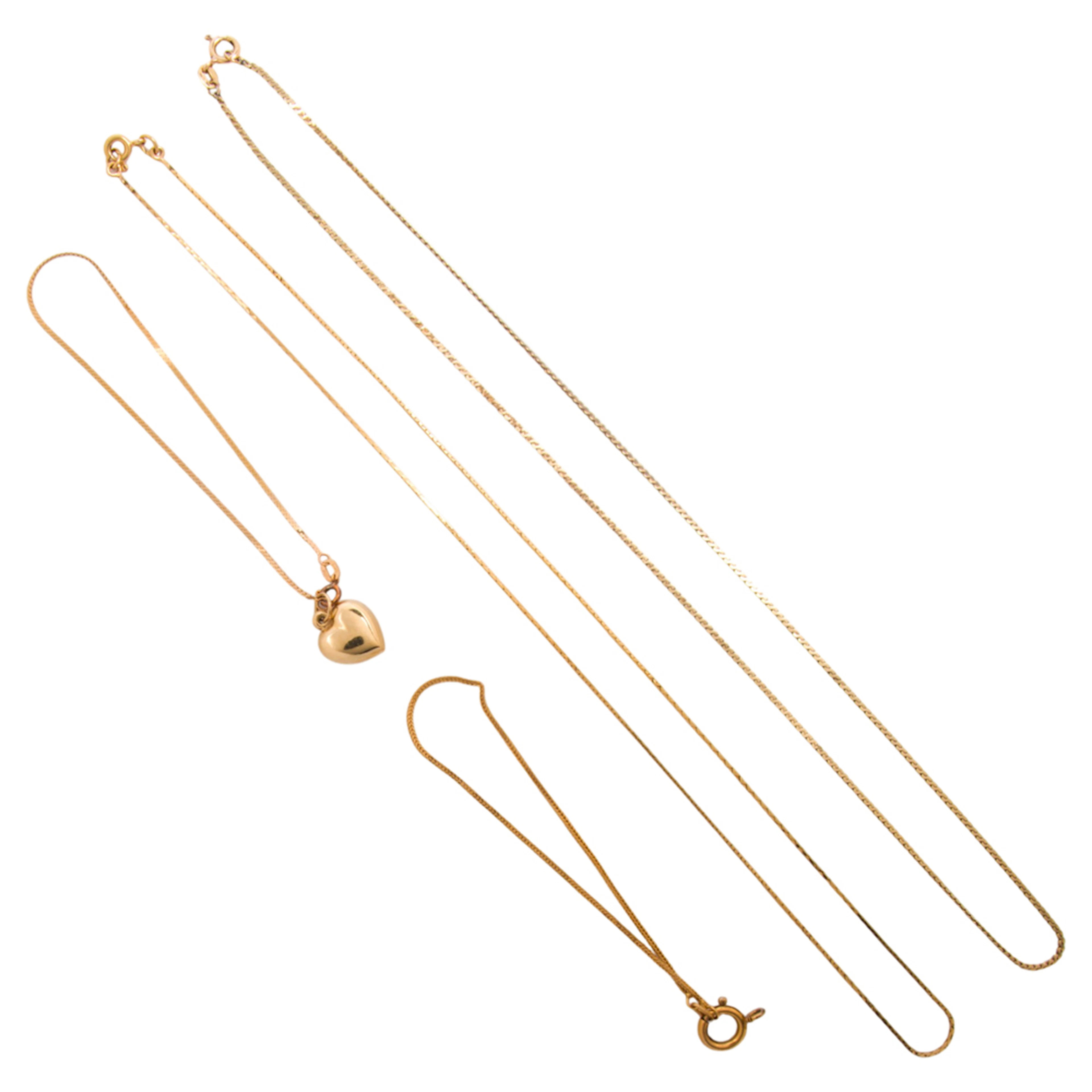 A group of 14k gold chains