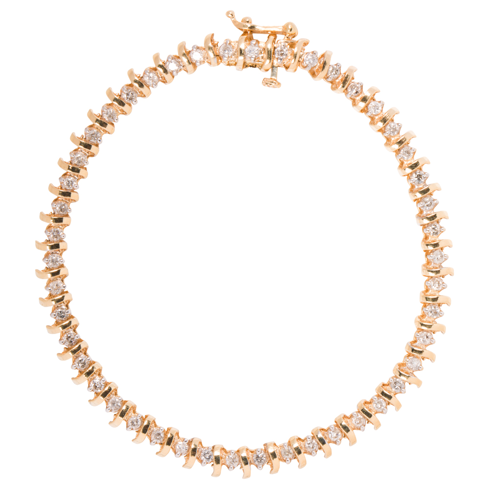 A diamond and 14k gold tennis bracelet