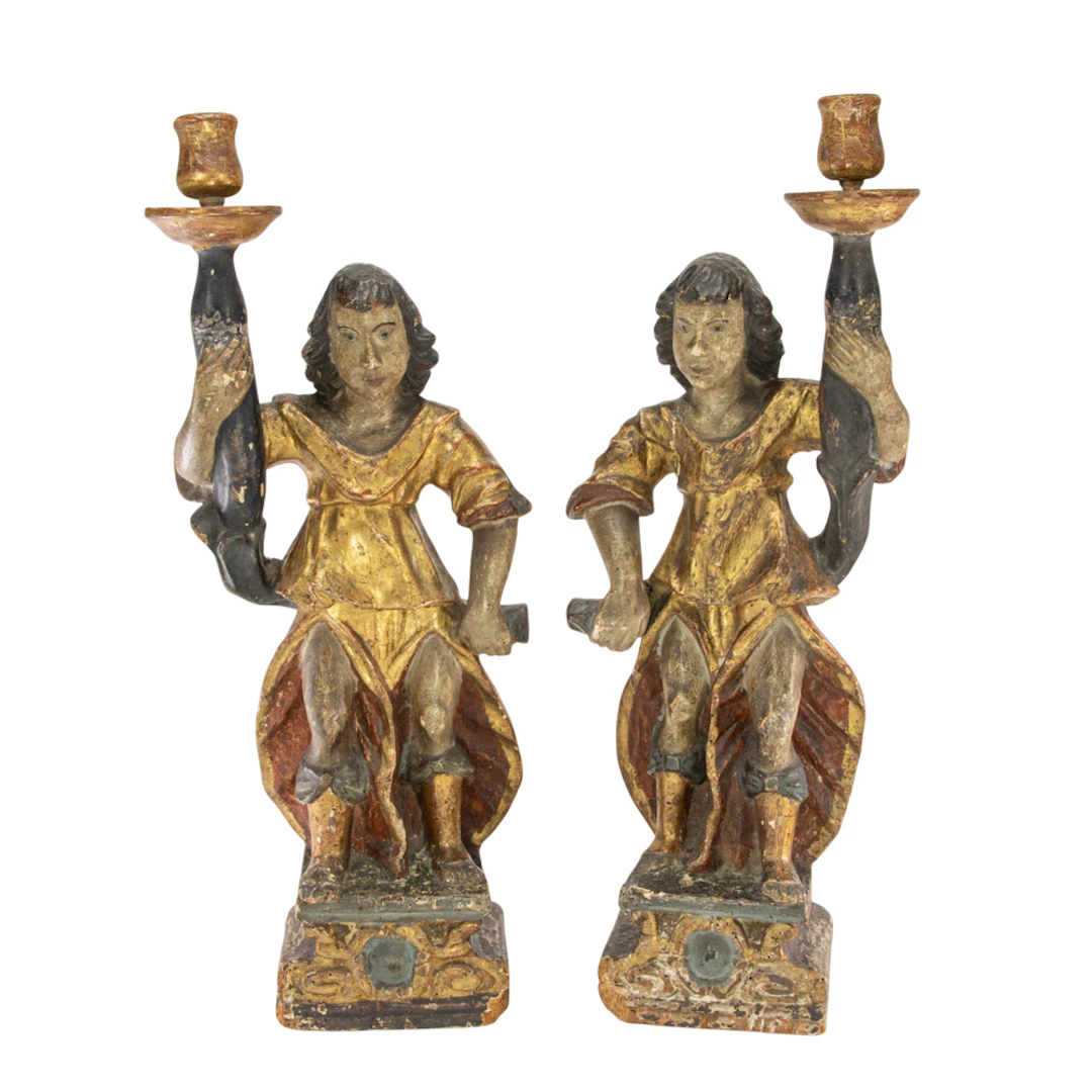 A pair of Continental polychrome and parcel gilt figural candlesticks