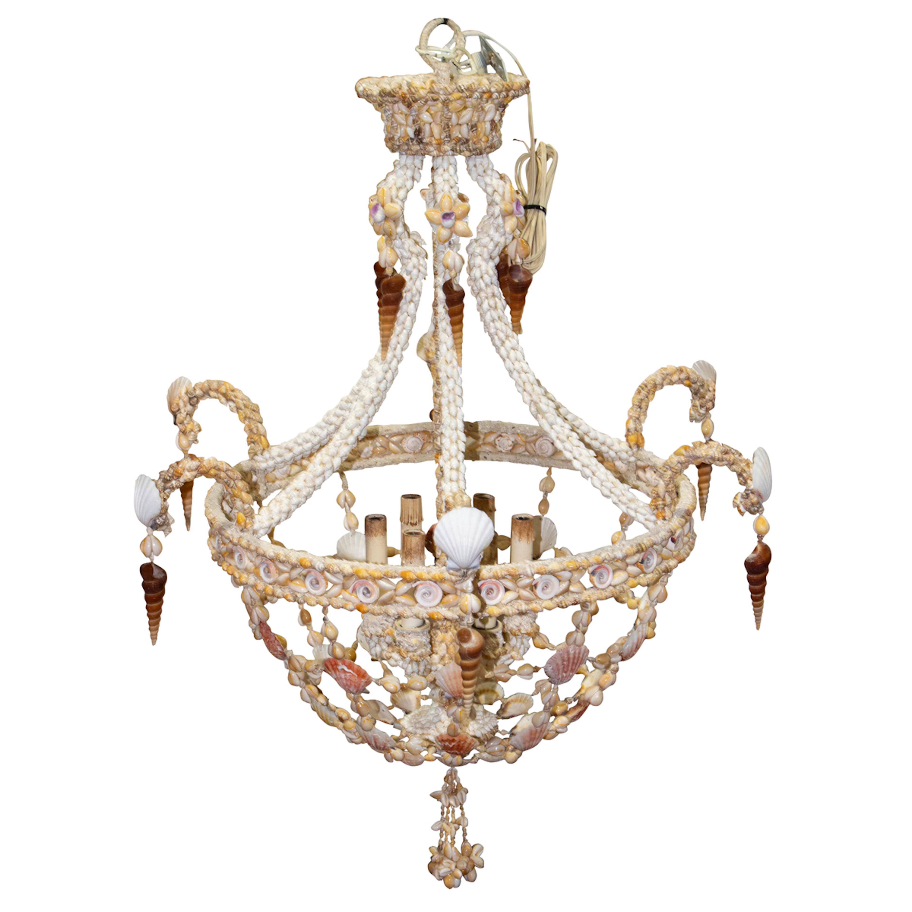 A shell encrusted six light chandelier created by Matthew Zwissler