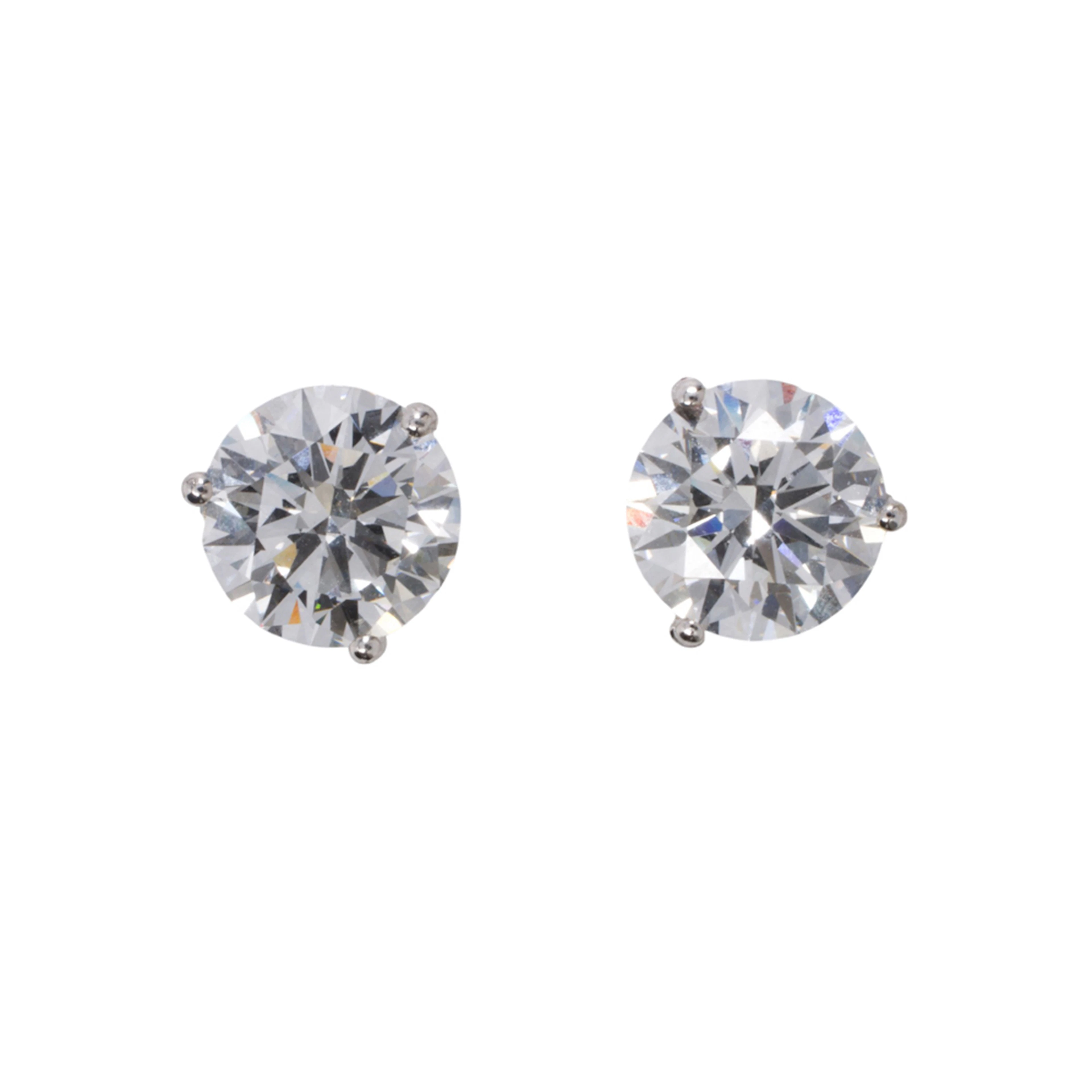 A pair of lab grown diamond and 14k white gold stud earrings