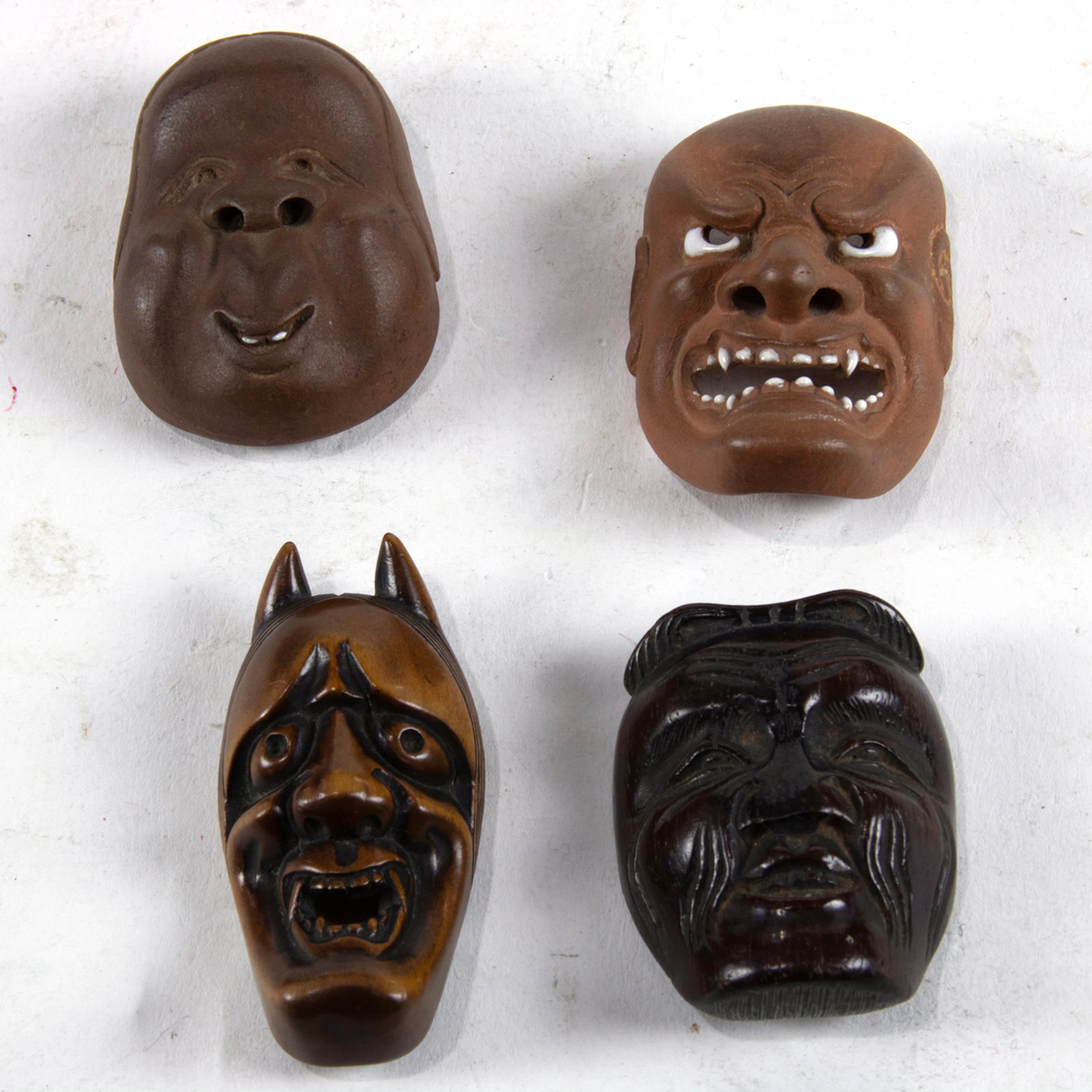 (lot of 4) Wood and clay netsuke masks