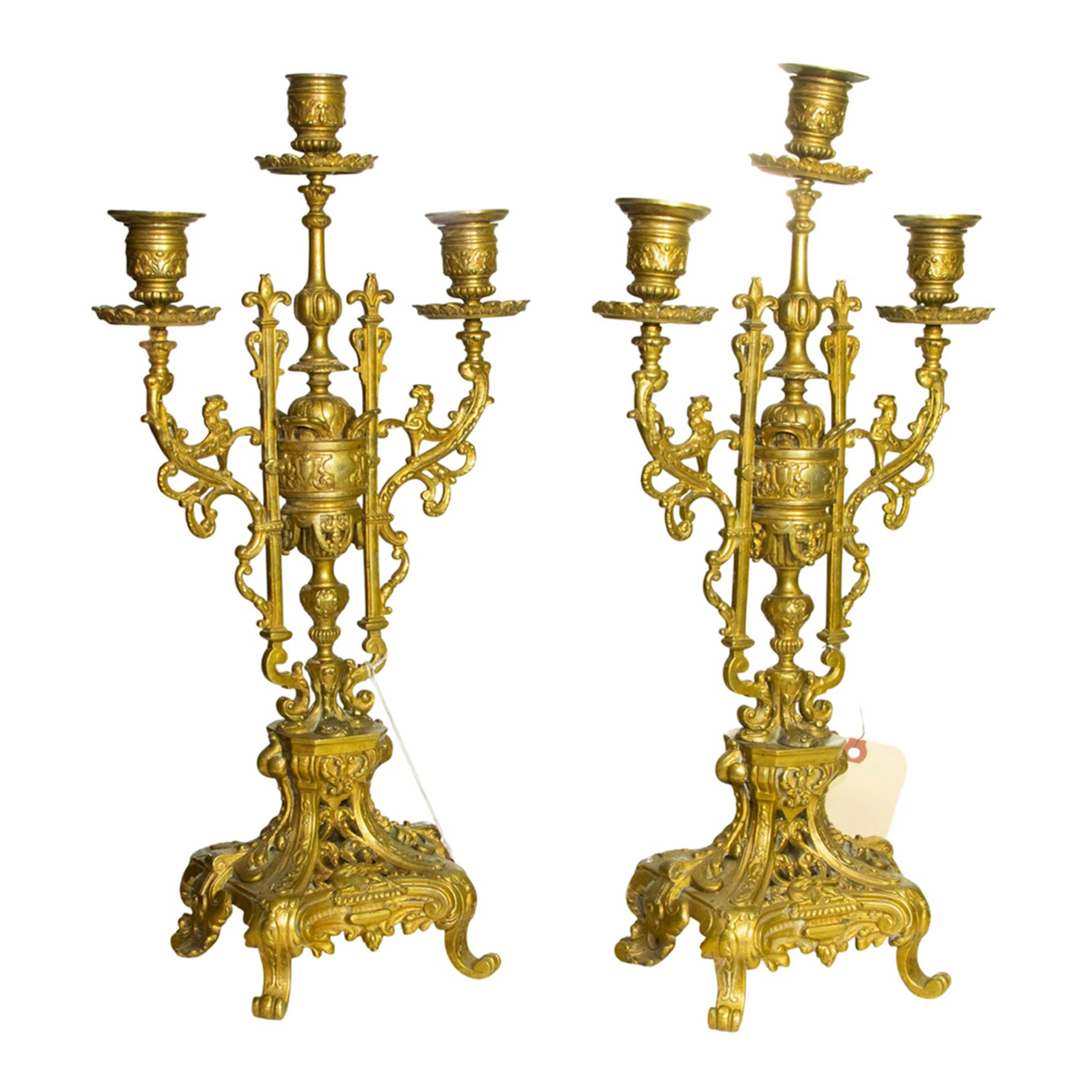 A pair of French gilt bronze three-light candelabra in the Renaissance