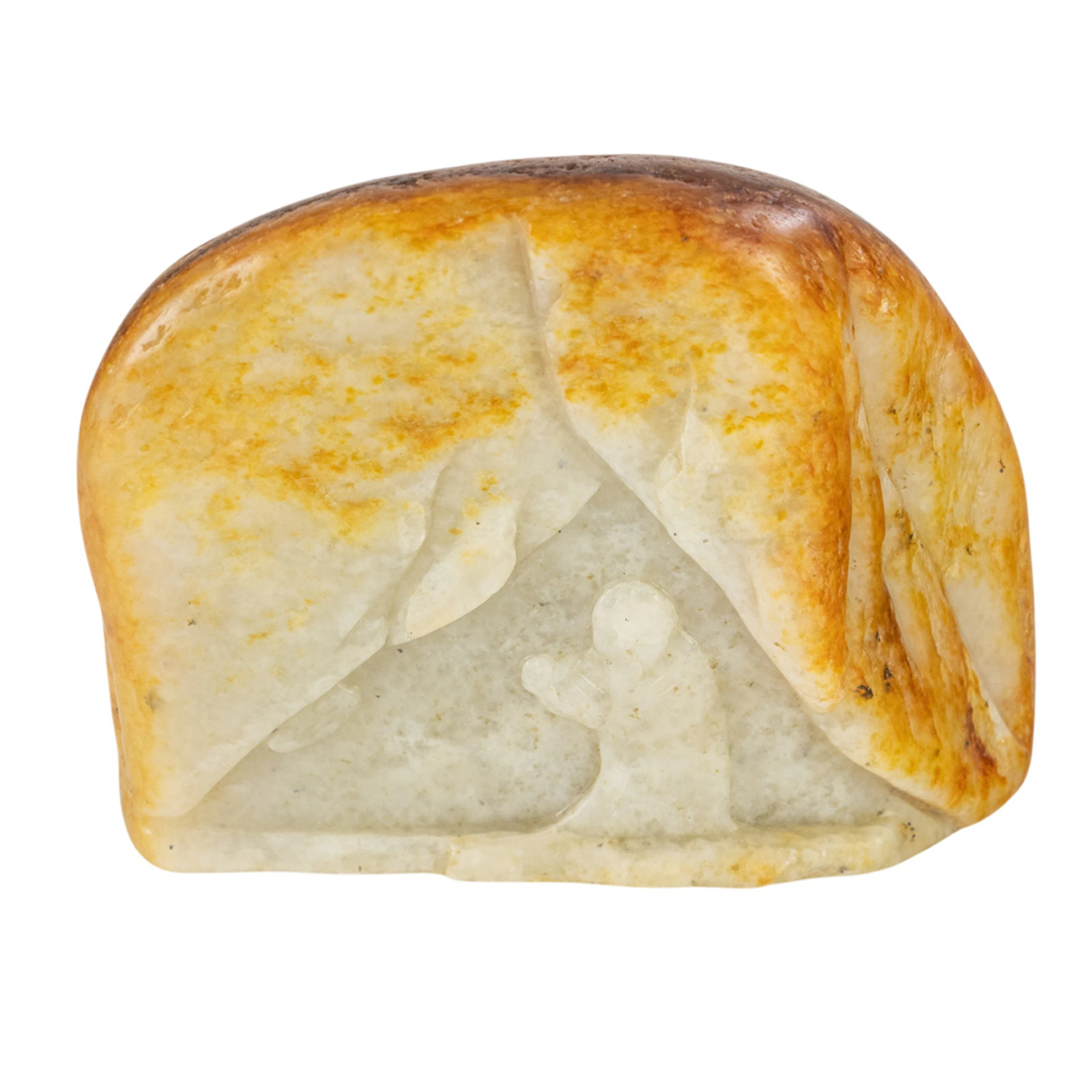 A Chinese russet and white jade carving