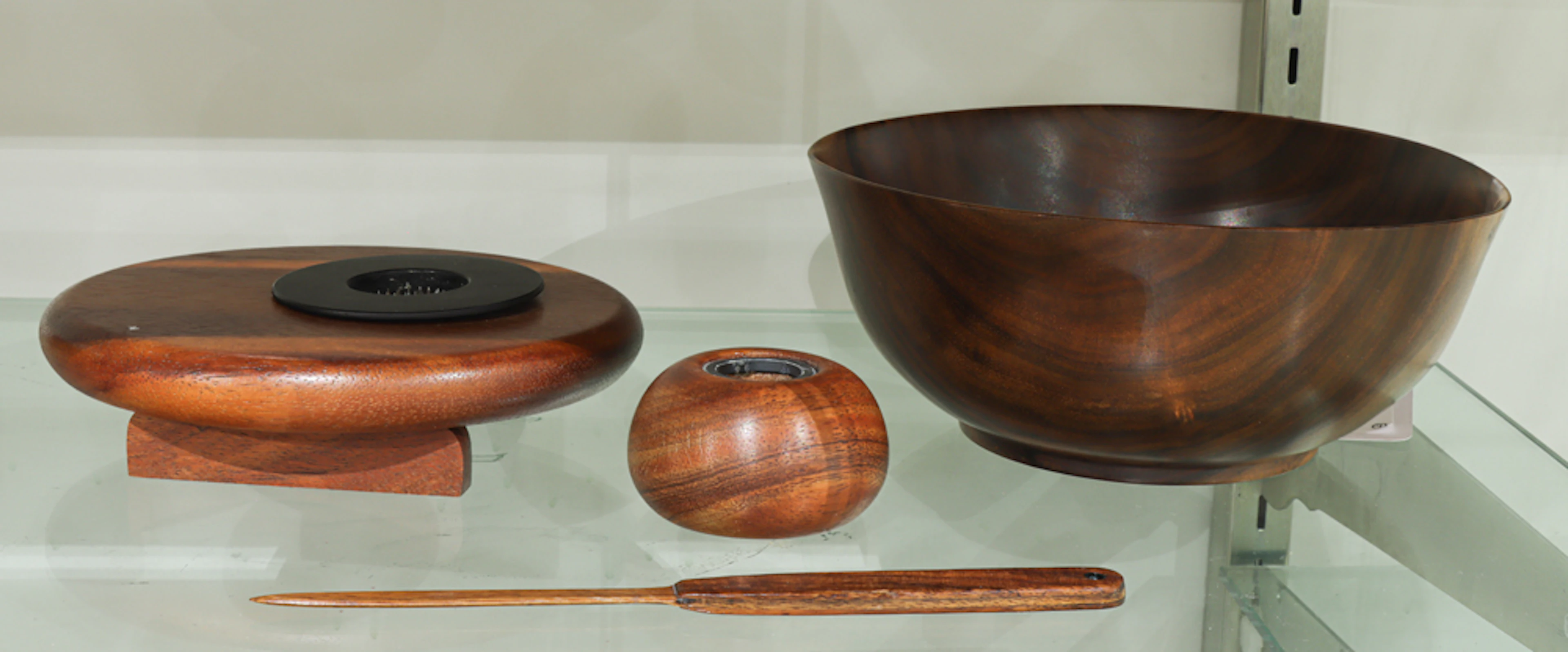 Four Hawaii Koa or Milo wood table accessories including Calvin Hamada