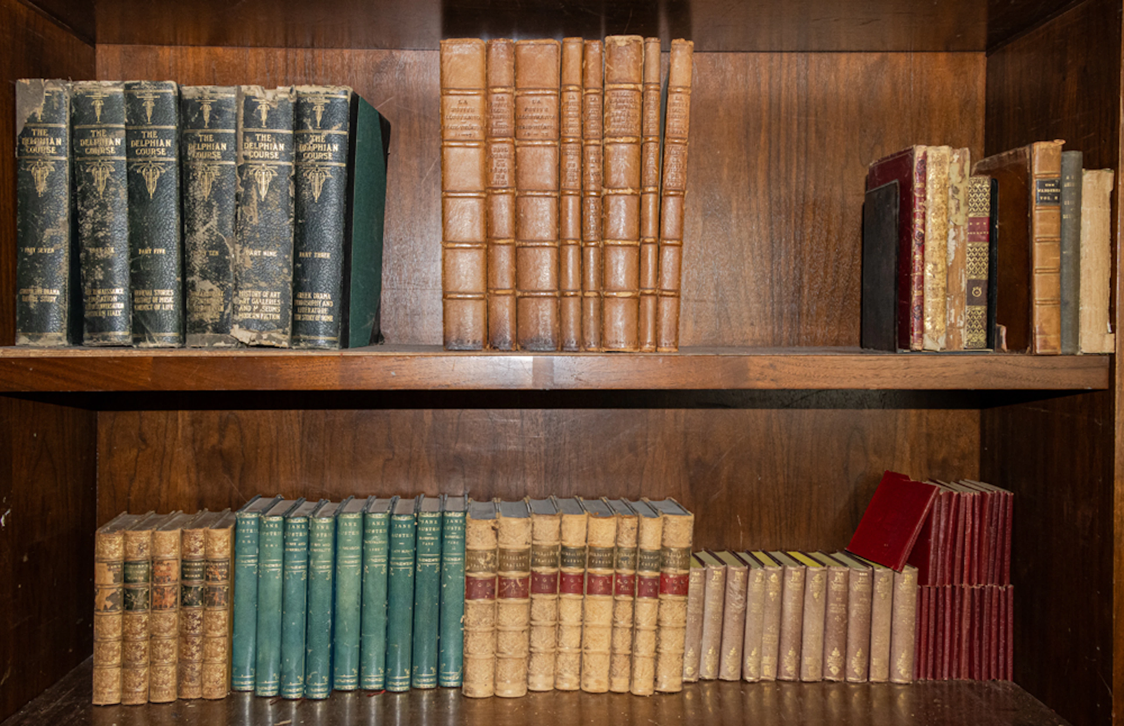 An assembled group of mainly antique hardback leather bound books