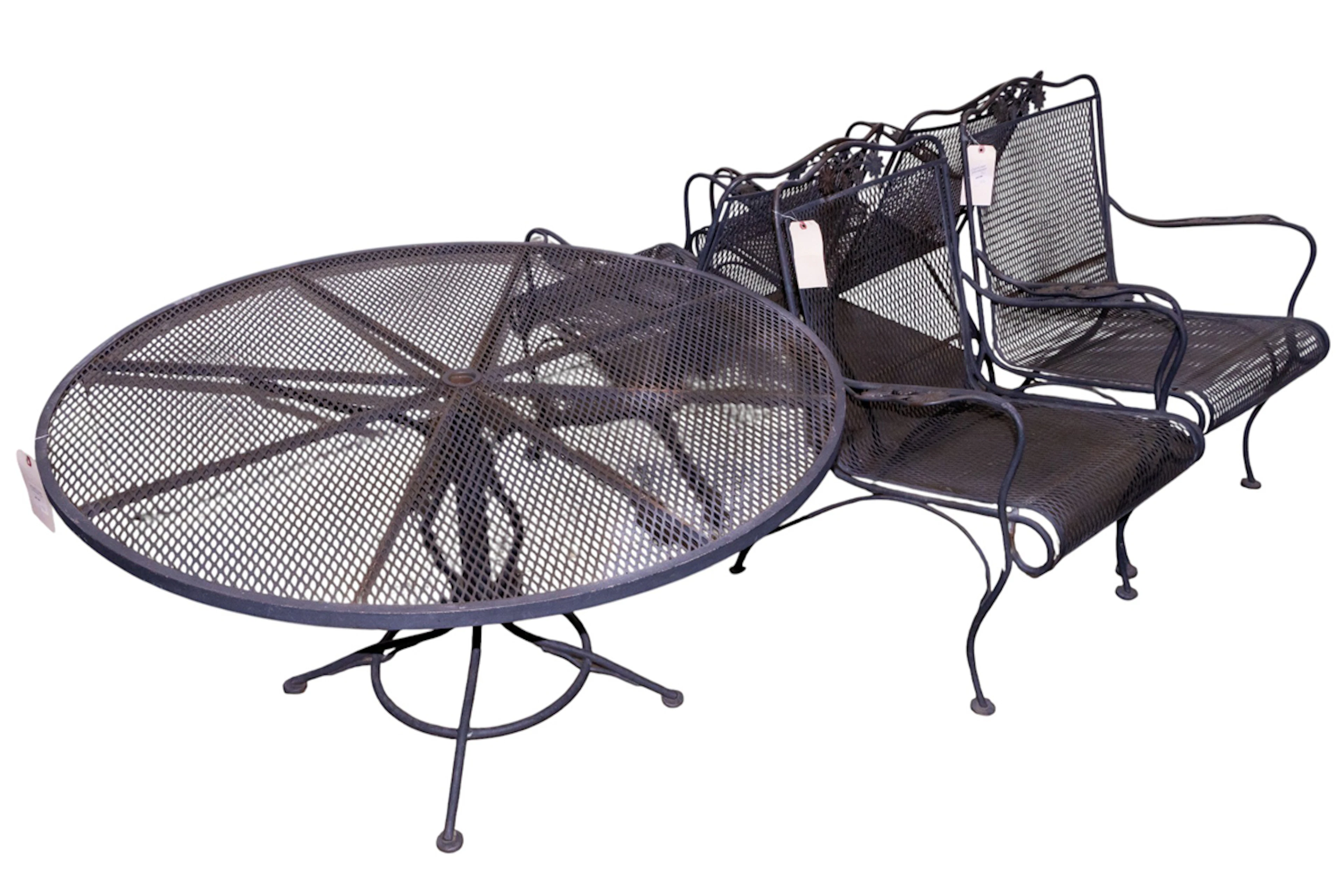 A five-piece wrought iron outdoor dining set
