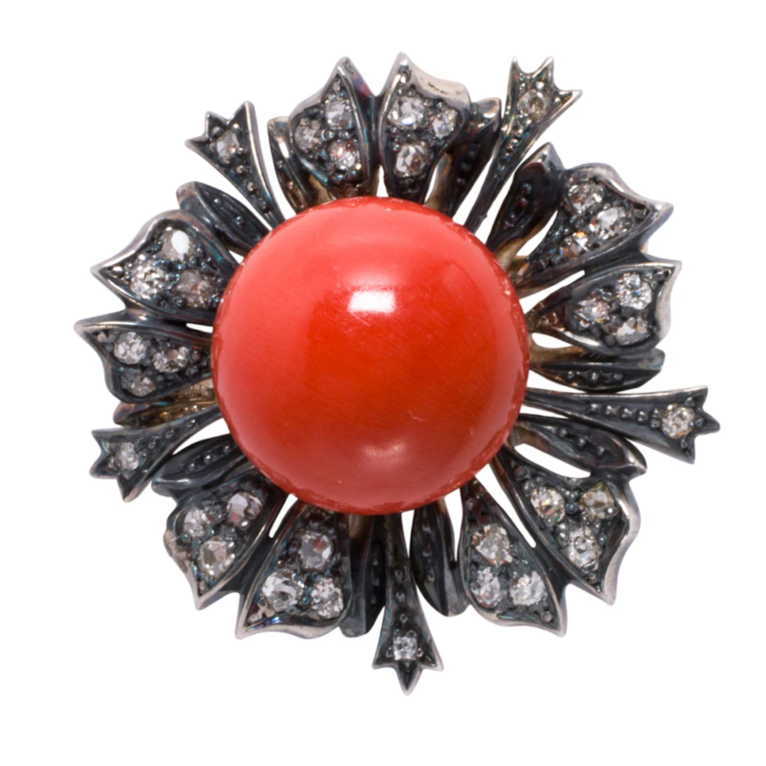 An antique style coral, diamond, and blackened silver-topped 10k rose